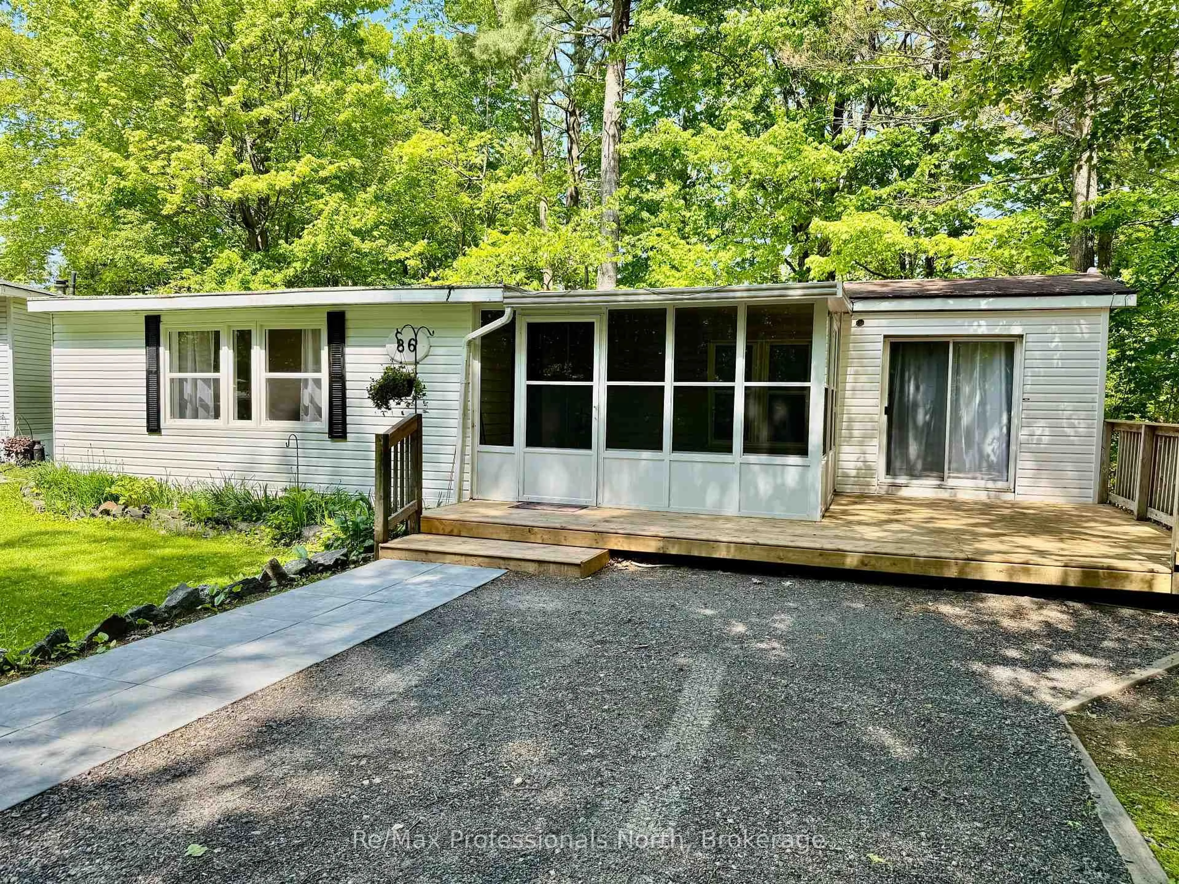 Home with vinyl exterior material, street for 1007 Racoon Rd #86, Gravenhurst Ontario P1P 1R1