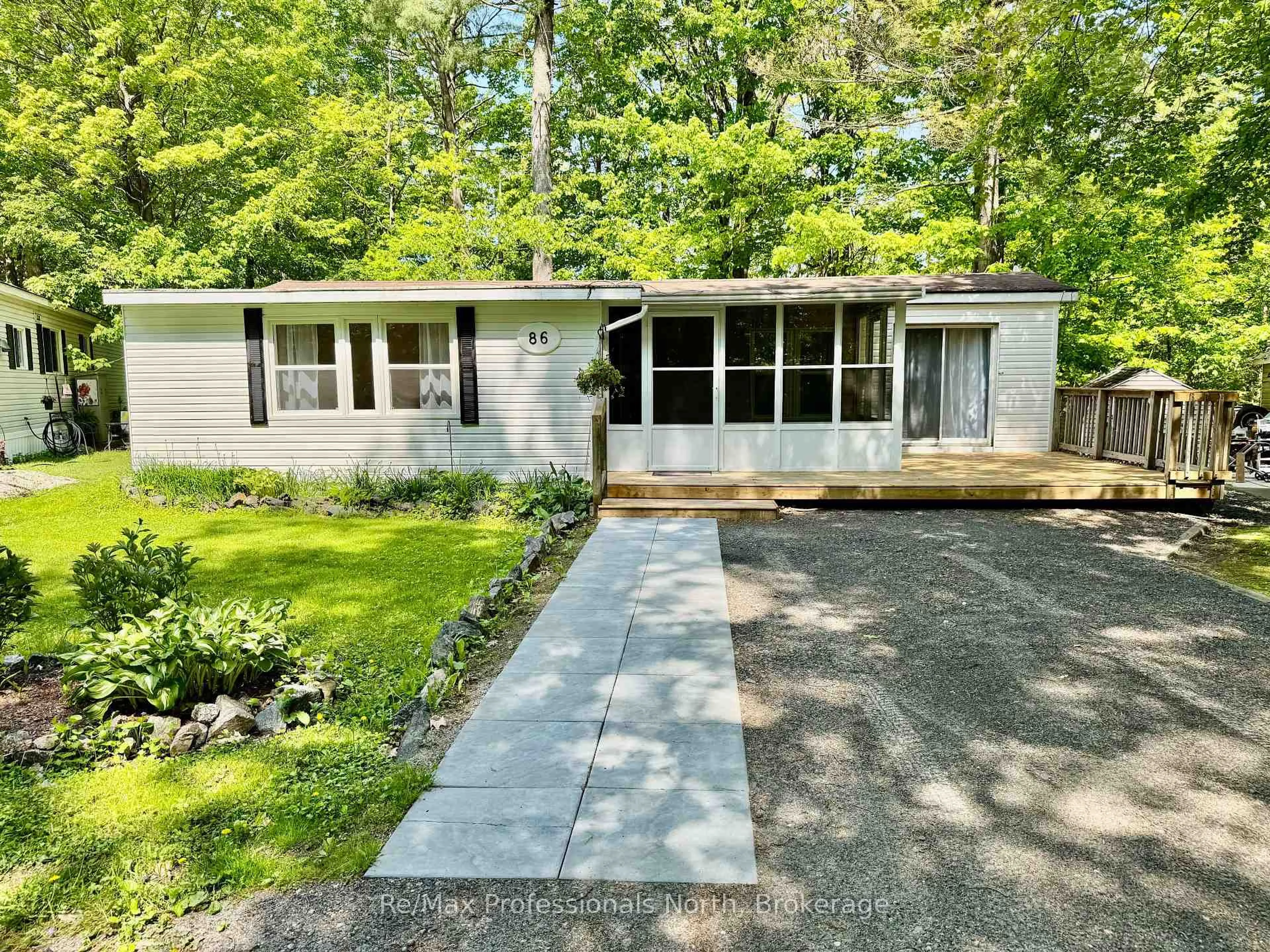 Home with vinyl exterior material, street for 1007 Racoon Rd #86, Gravenhurst Ontario P1P 1R1