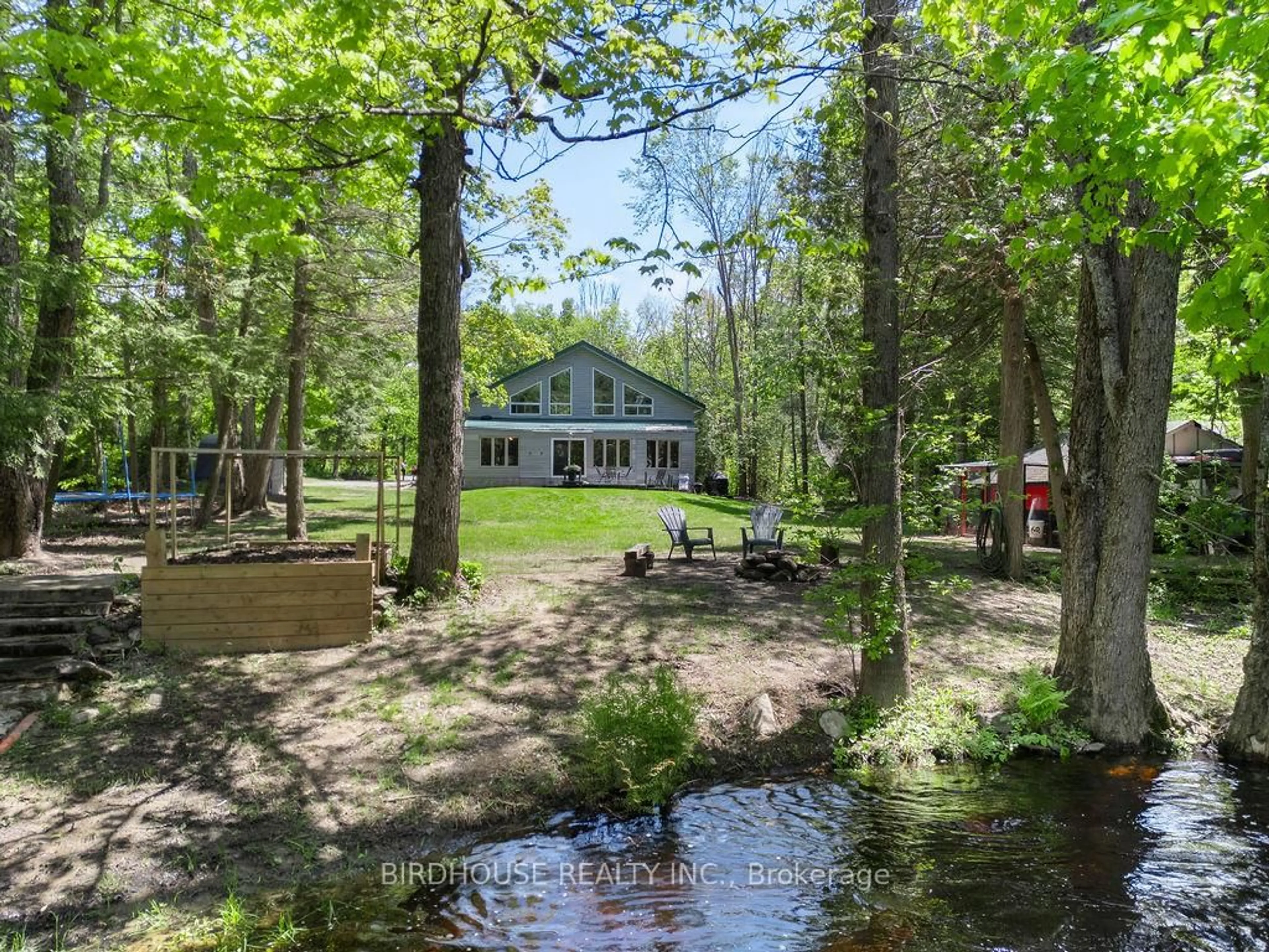 A pic from outside/outdoor area/front of a property/back of a property/a pic from drone, water/lake/river/ocean view for 398 Edwina Dr, Trent Lakes Ontario K0M 1A0