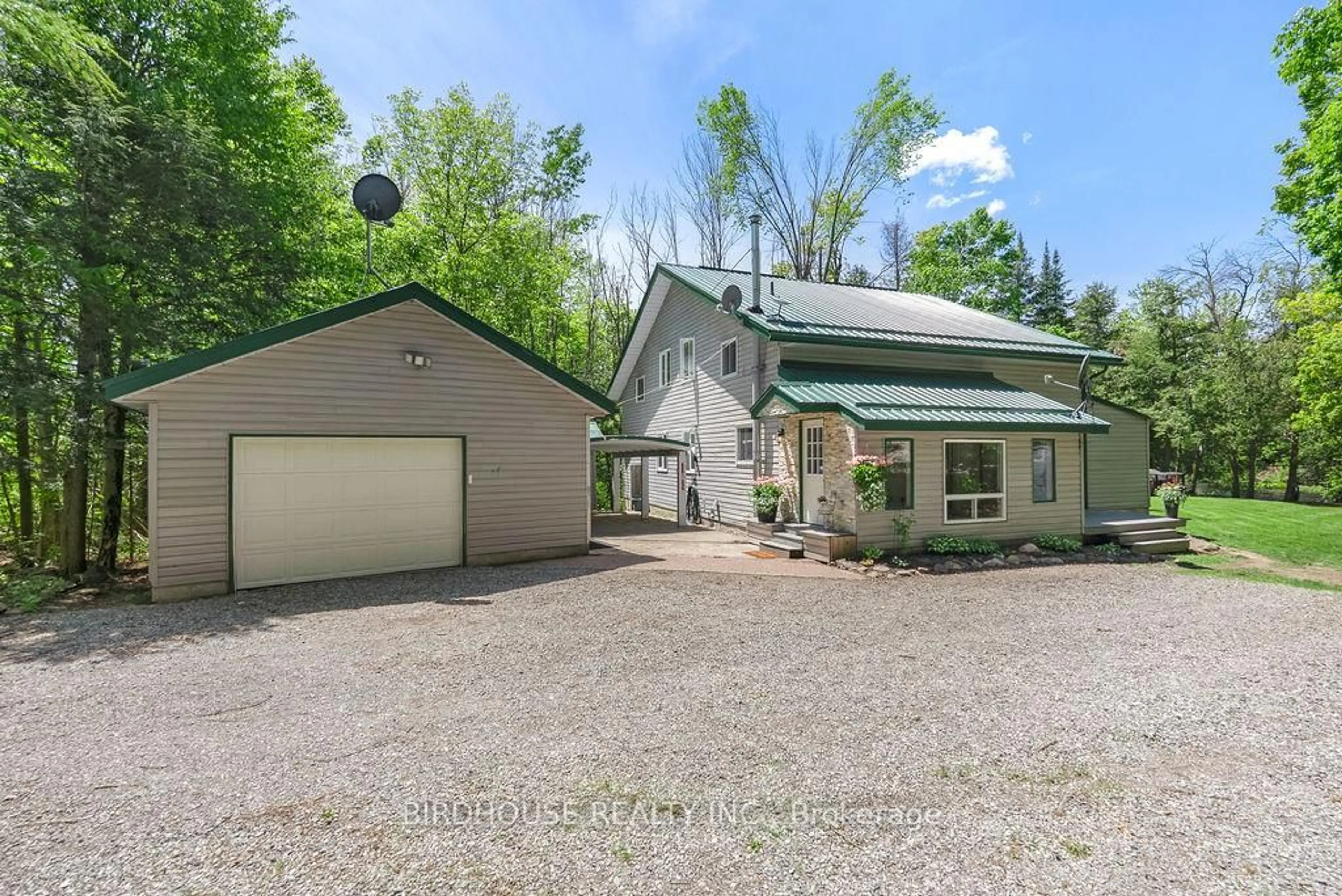 A pic from outside/outdoor area/front of a property/back of a property/a pic from drone, street for 398 Edwina Dr, Trent Lakes Ontario K0M 1A0