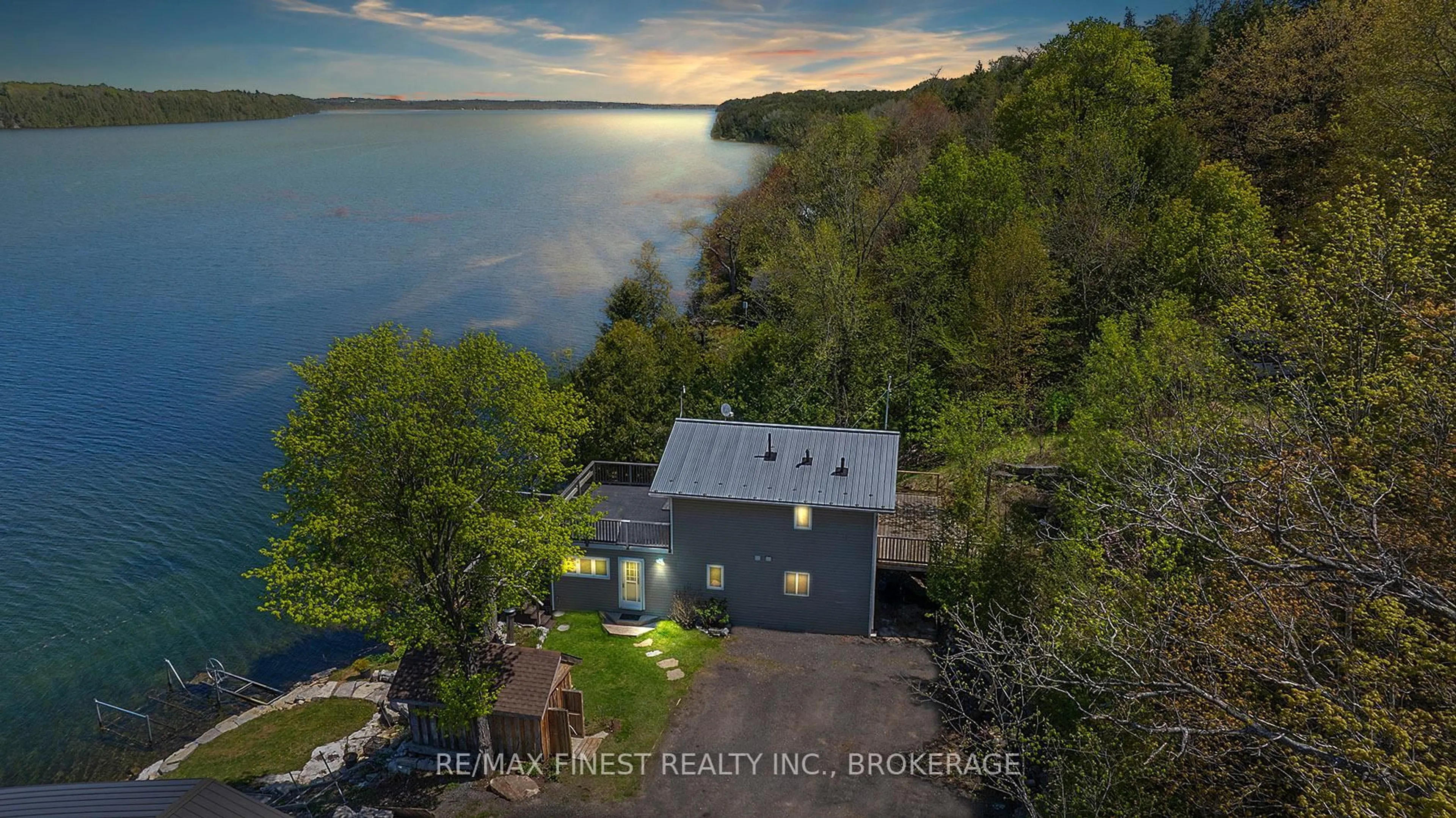 A pic from outside/outdoor area/front of a property/back of a property/a pic from drone, water/lake/river/ocean view for 1048 Lark Lane, Inverary Ontario K0H 1X0