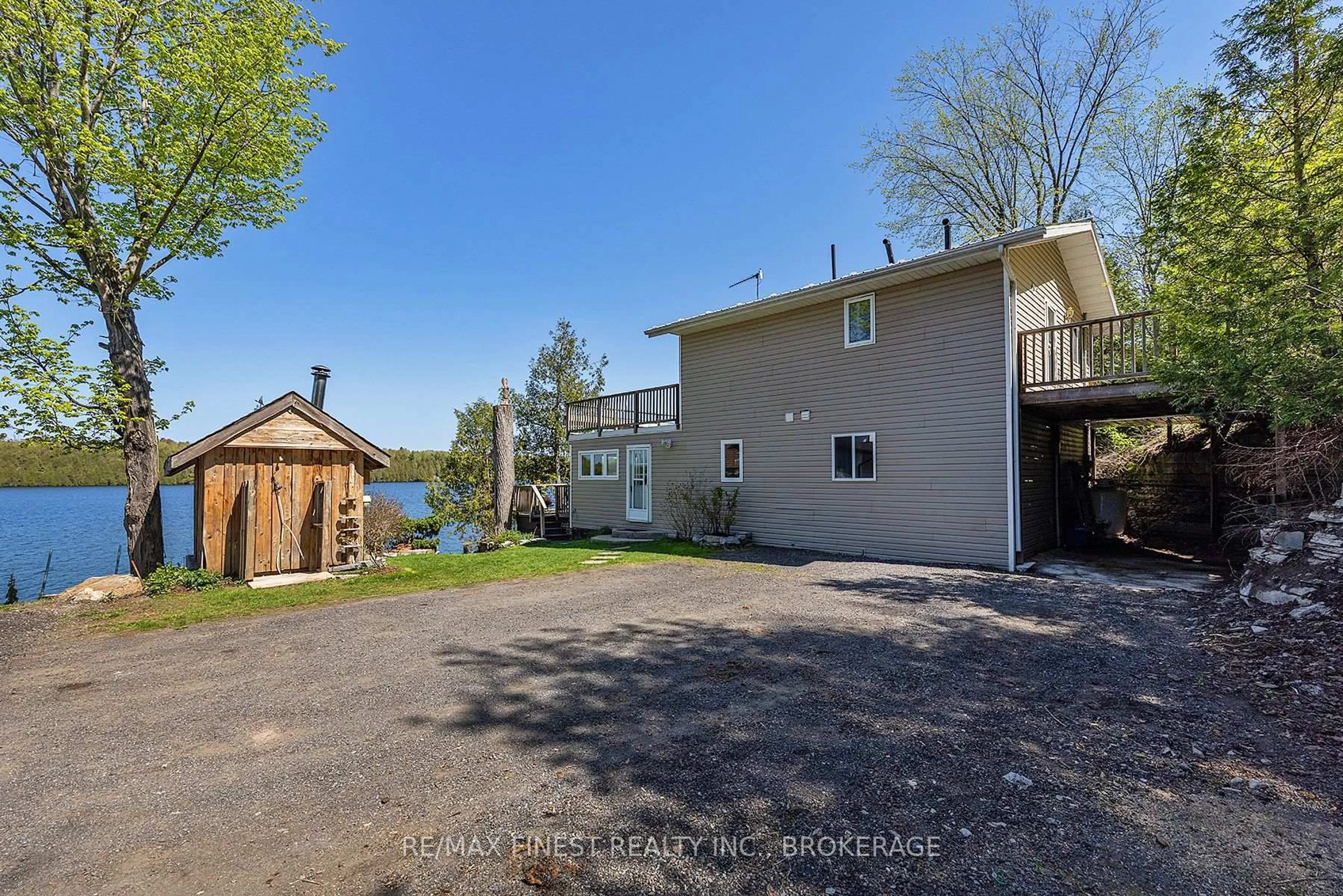 A pic from outside/outdoor area/front of a property/back of a property/a pic from drone, water/lake/river/ocean view for 1048 Lark Lane, Inverary Ontario K0H 1X0