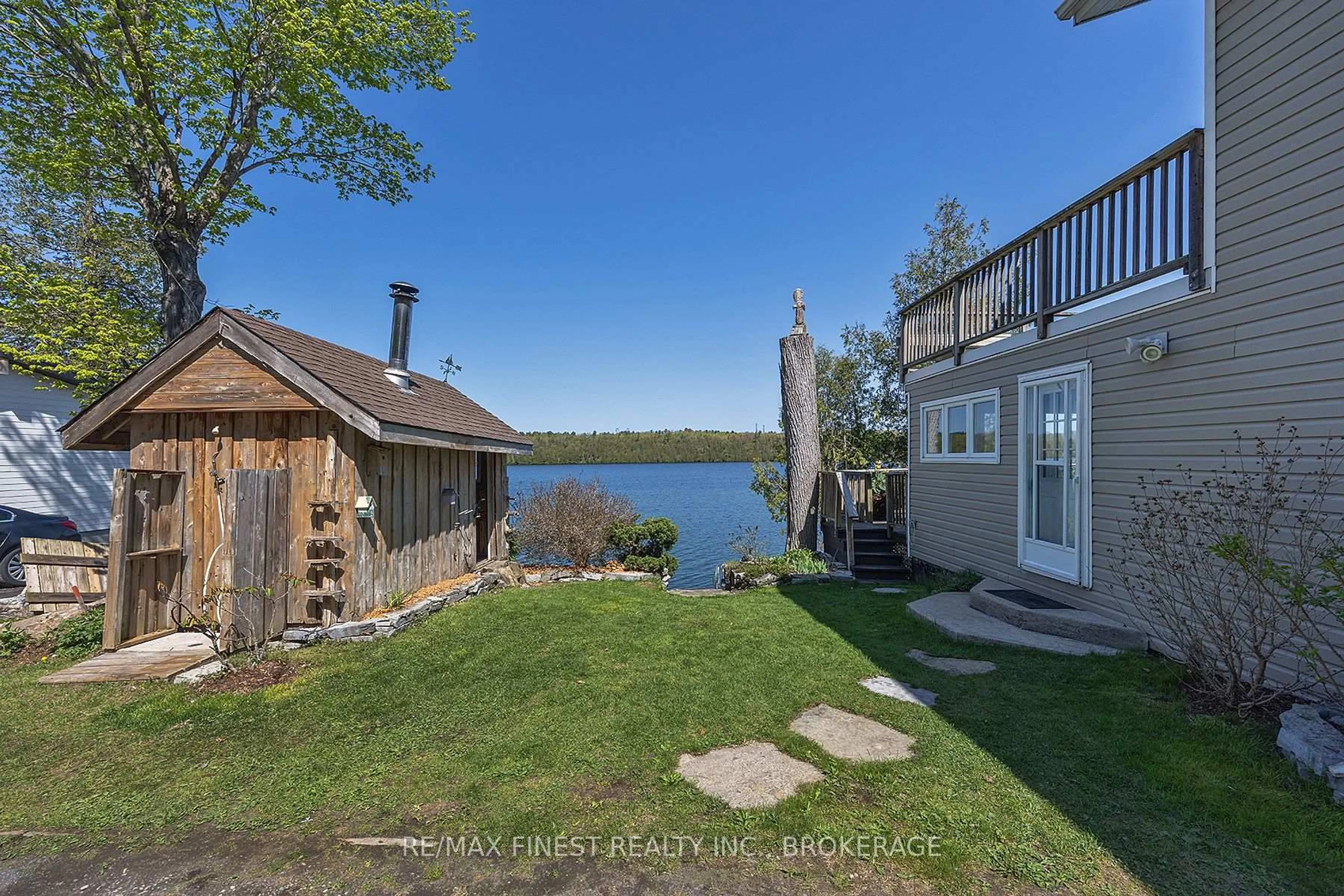 A pic from outside/outdoor area/front of a property/back of a property/a pic from drone, water/lake/river/ocean view for 1048 Lark Lane, Inverary Ontario K0H 1X0