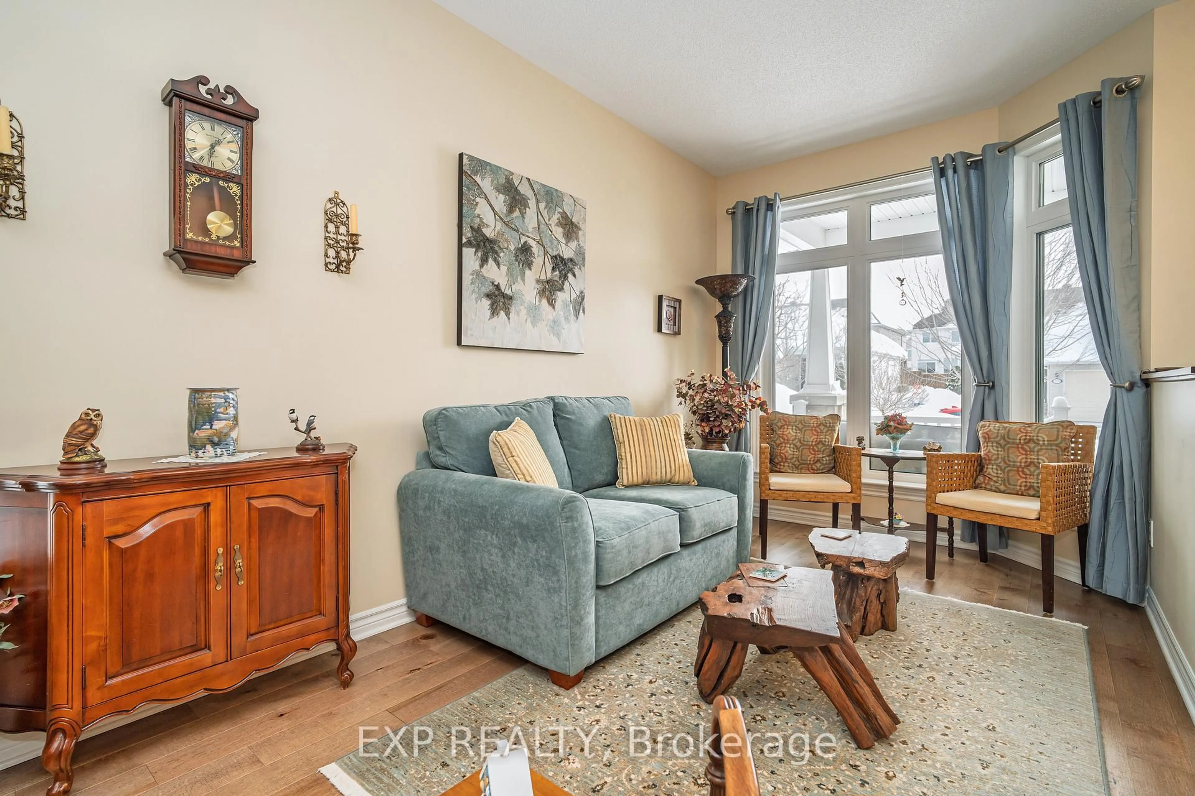 Living room with furniture, wood/laminate floor for 208 Voie De Brouage Way, Ottawa Ontario K4A 0Y5