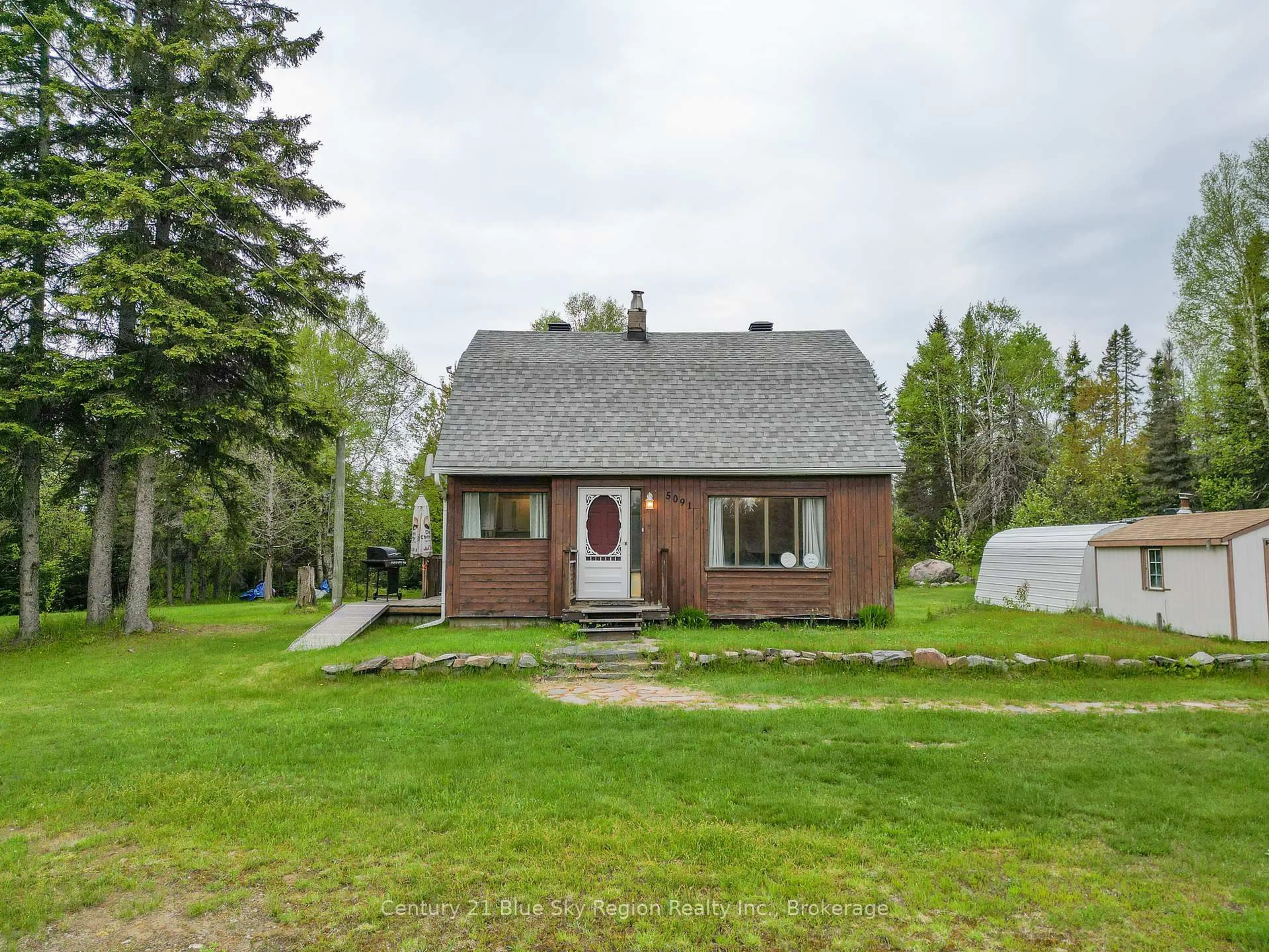 A pic from outside/outdoor area/front of a property/back of a property/a pic from drone, street for 5091 Highway 11, North Bay Ontario P1B 8G3