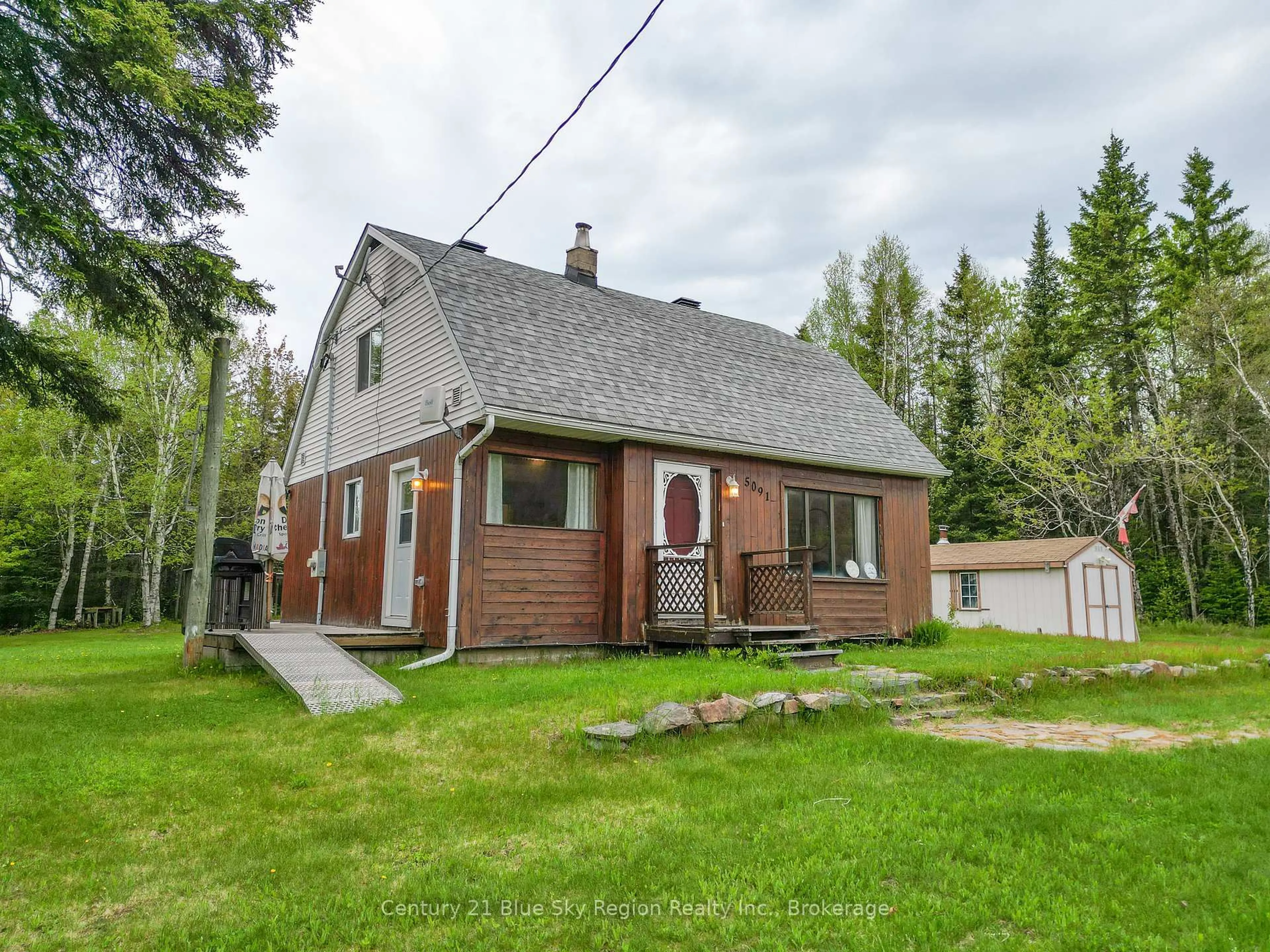 A pic from outside/outdoor area/front of a property/back of a property/a pic from drone, street for 5091 Highway 11, North Bay Ontario P1B 8G3