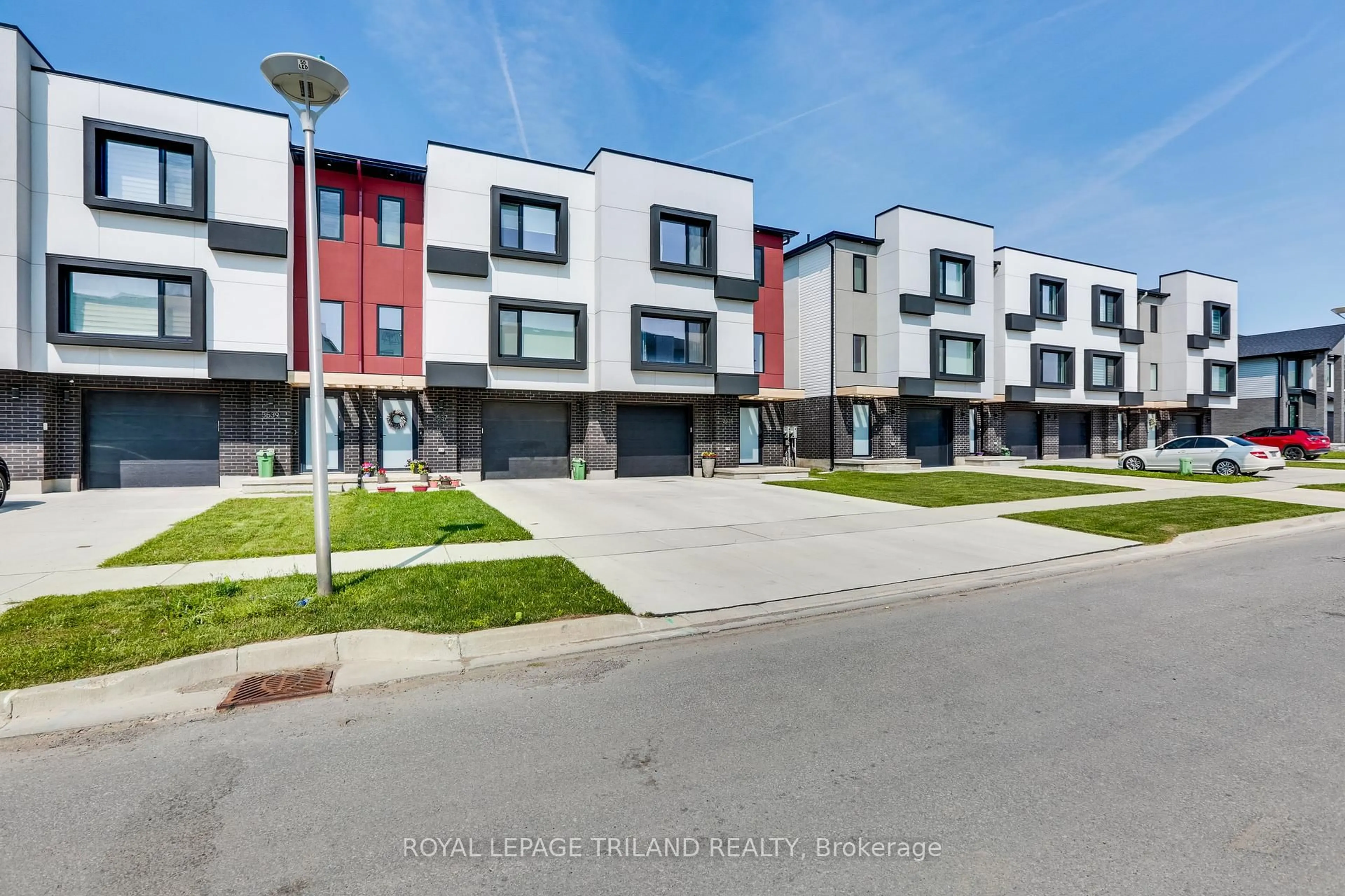 A pic from outside/outdoor area/front of a property/back of a property/a pic from drone, street for 3535 Emily Carr Lane, London South Ontario N6L 0H7