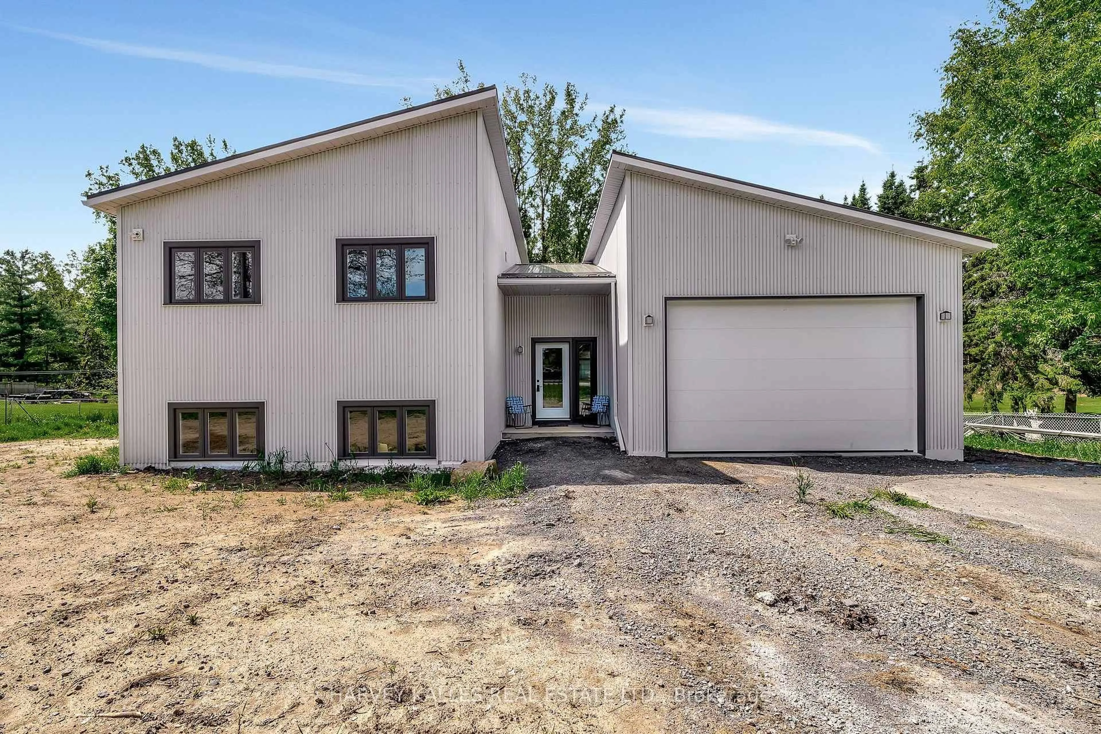 Home with vinyl exterior material, street for 55 COUNTY ROAD 1 N/A, Prince Edward County Ontario K0K 2T0