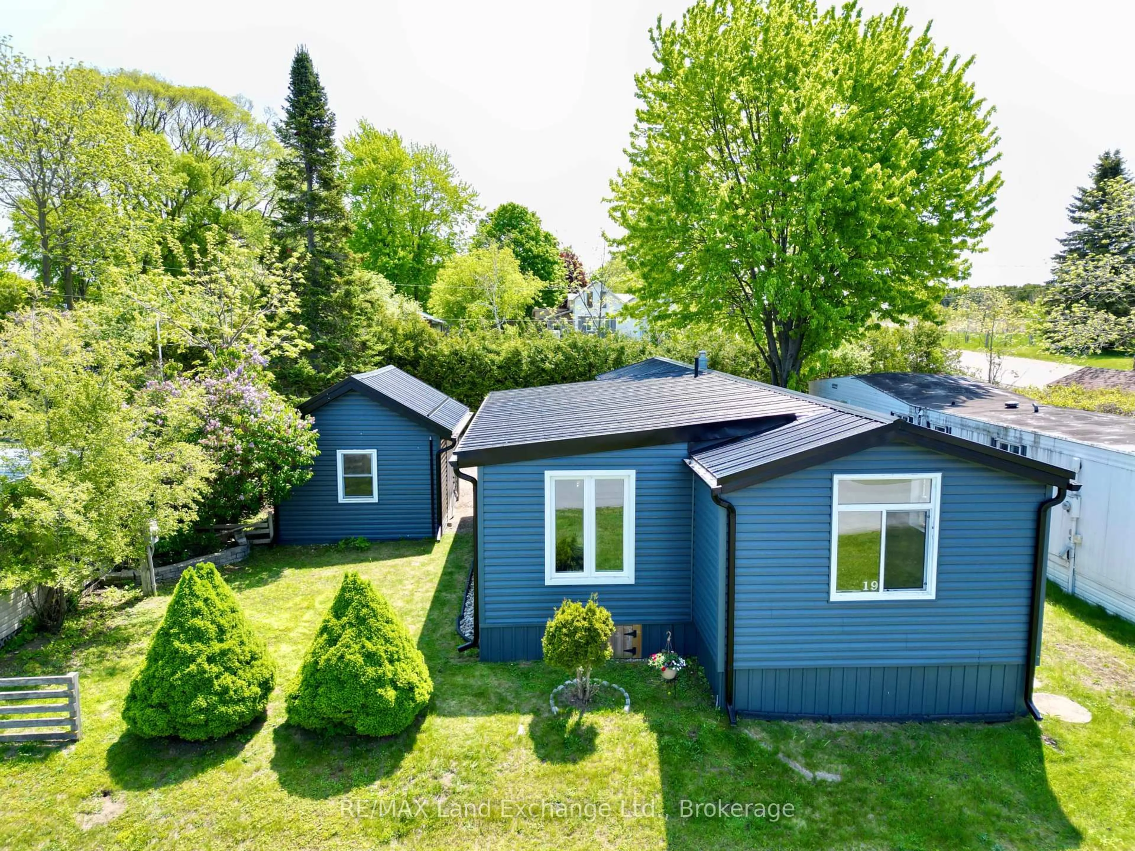 A pic from outside/outdoor area/front of a property/back of a property/a pic from drone, street for 332-19 Concession 6 Rd, Saugeen Shores Ontario N0H 2C7