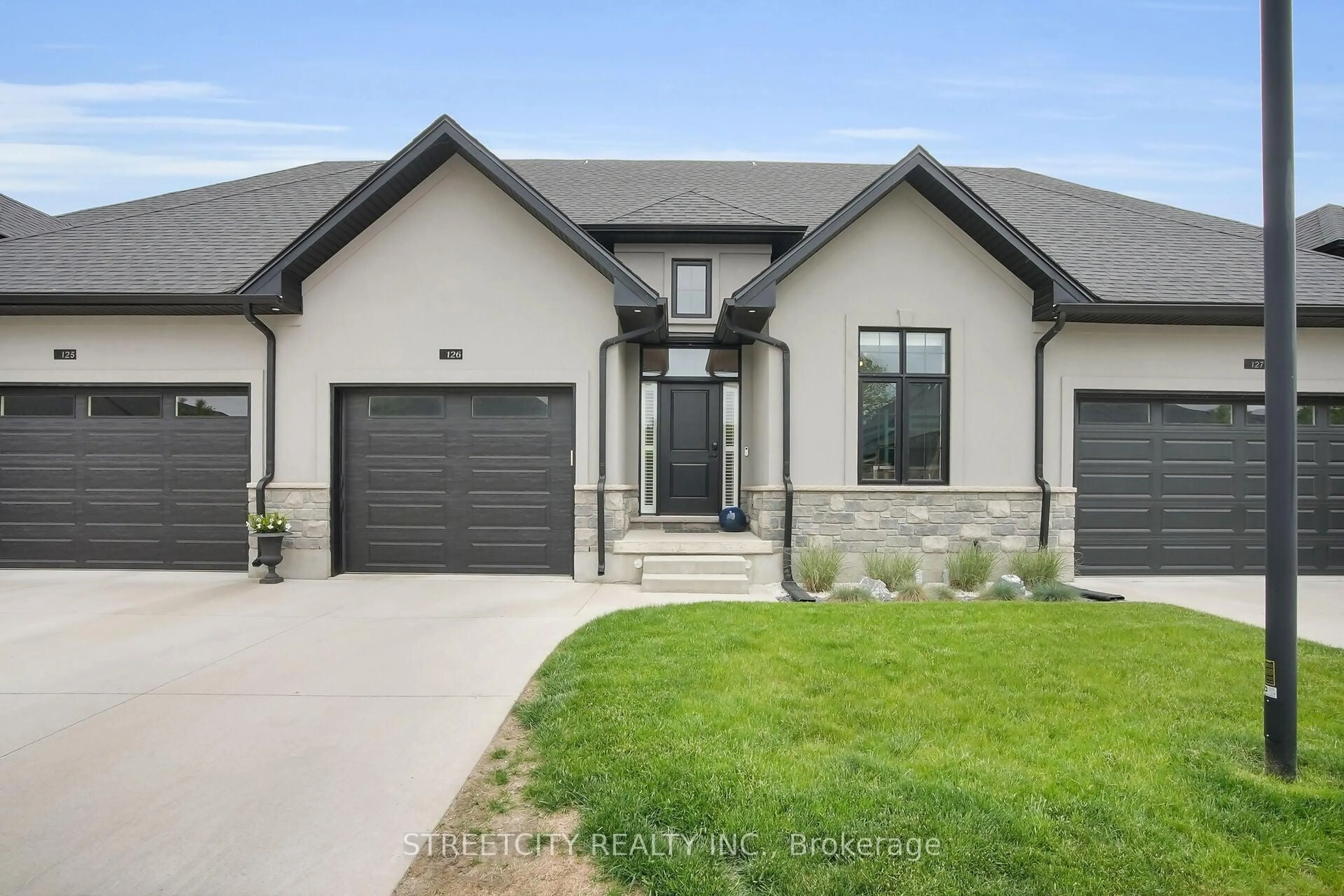 Home with brick exterior material, street for 9861 Glendon Dr #126, Middlesex Centre Ontario N0L 1R0