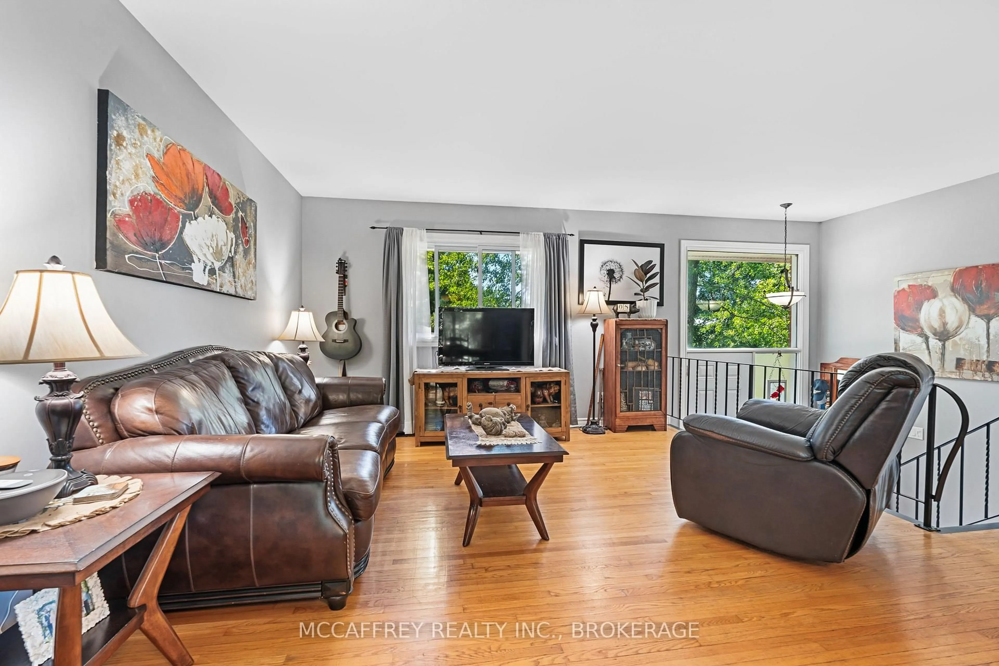 Living room with furniture, wood/laminate floor for 102 WRIGHT Pl, Bath Ontario K0H 1G0