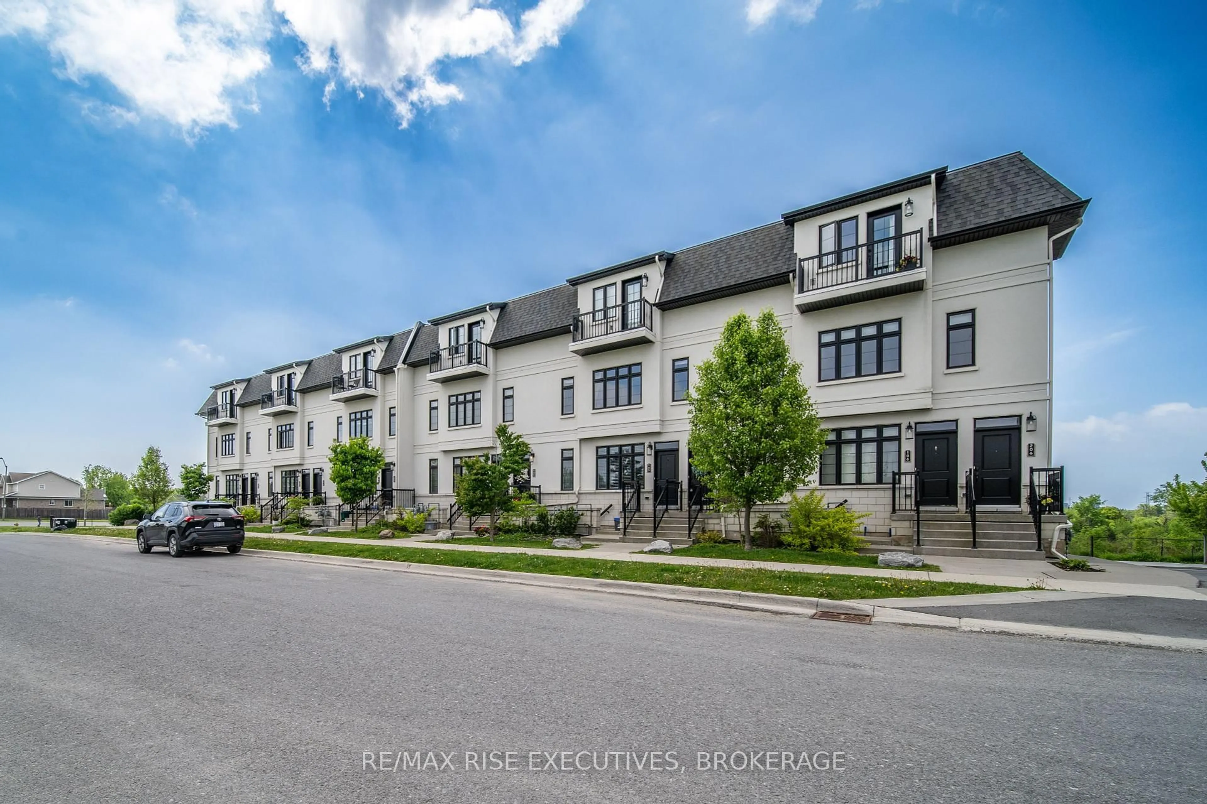 A pic from outside/outdoor area/front of a property/back of a property/a pic from drone, street for 1005 Terra Verde Way #102, Kingston Ontario K7P 0T8