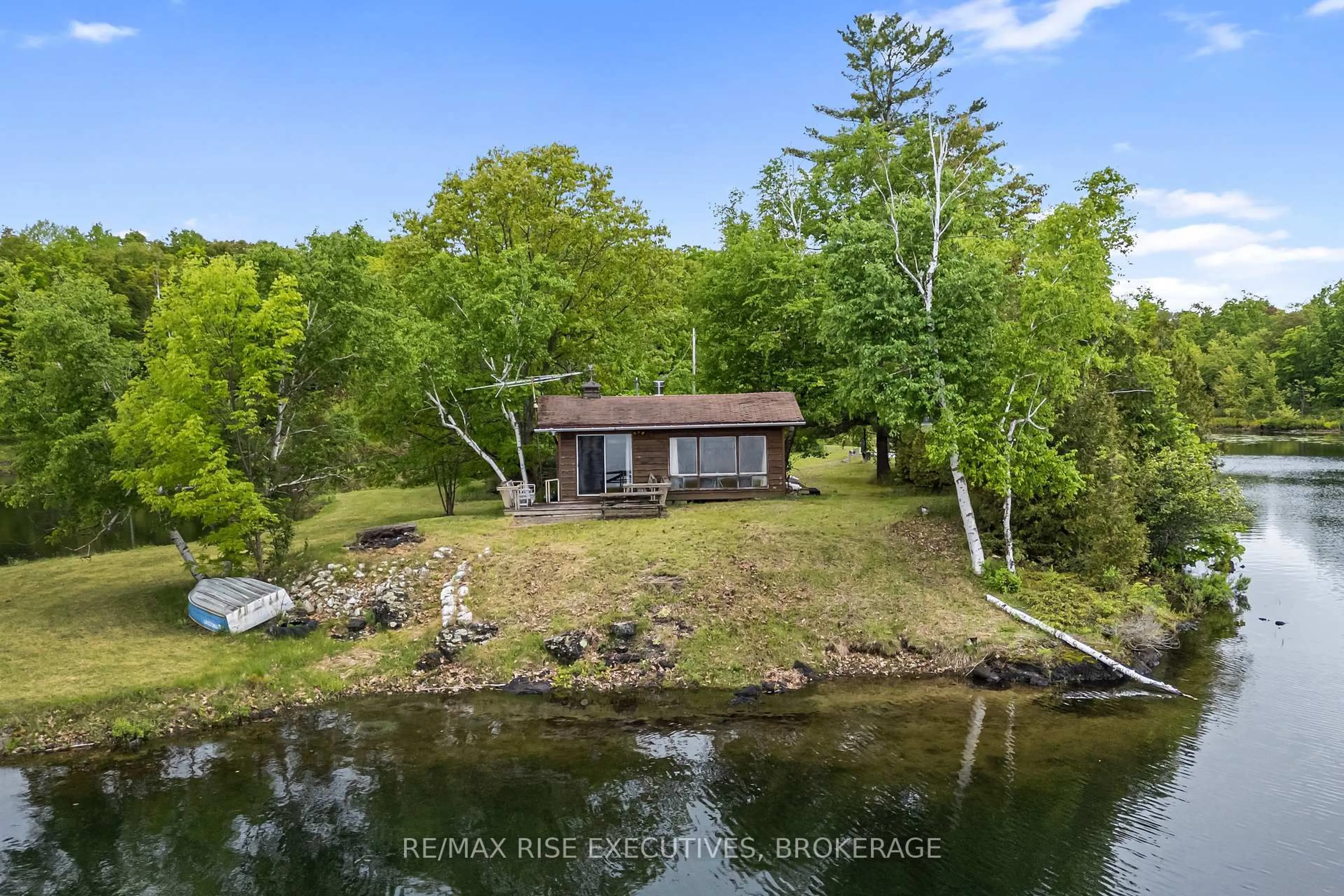 A pic from outside/outdoor area/front of a property/back of a property/a pic from drone, water/lake/river/ocean view for 332 Steve Babcock Lane, Hartington Ontario K0H 1W0