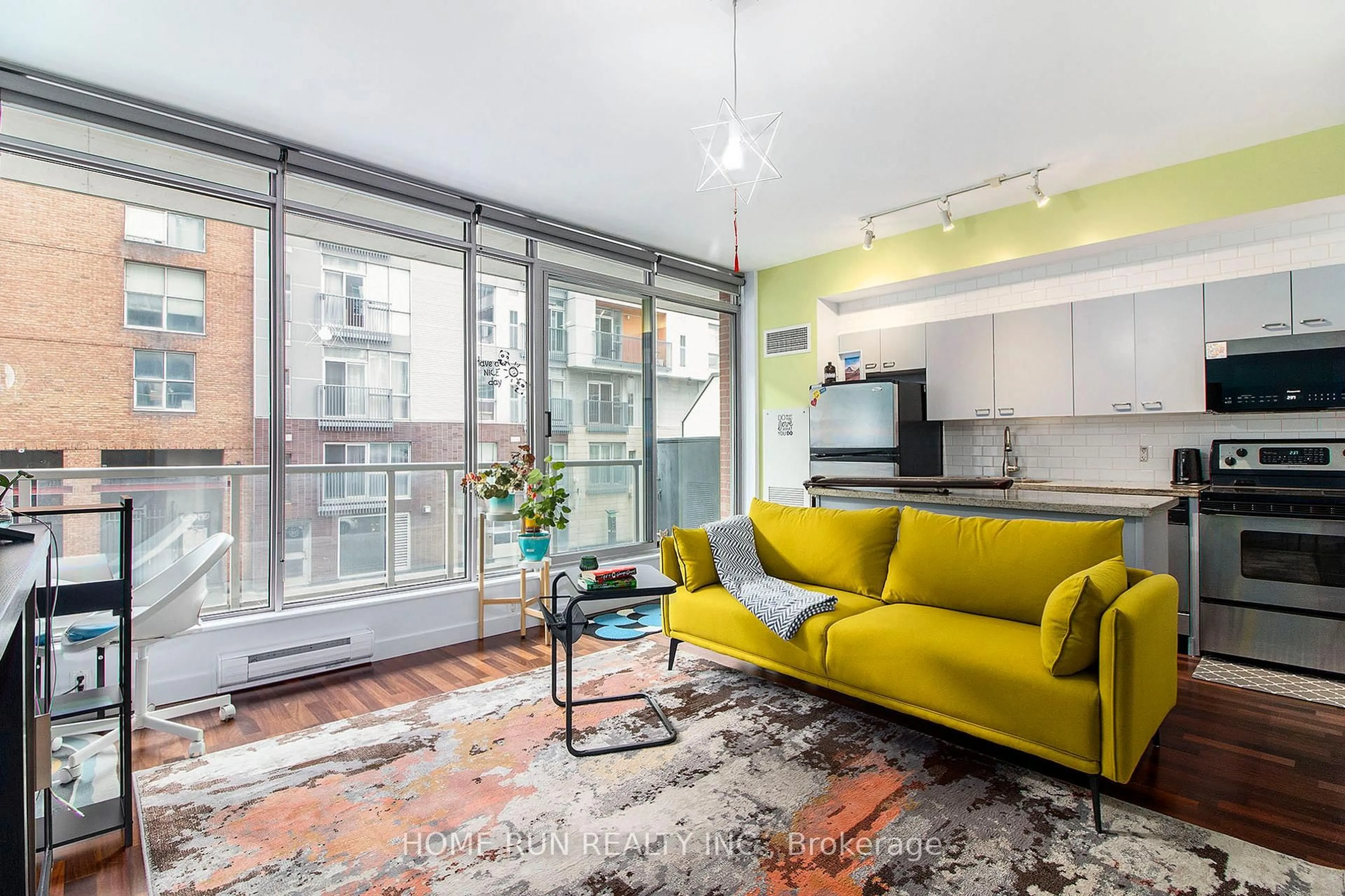 Living room with furniture, cement floor for 383 Cumberland St #202, Ottawa Ontario K1N 1J7