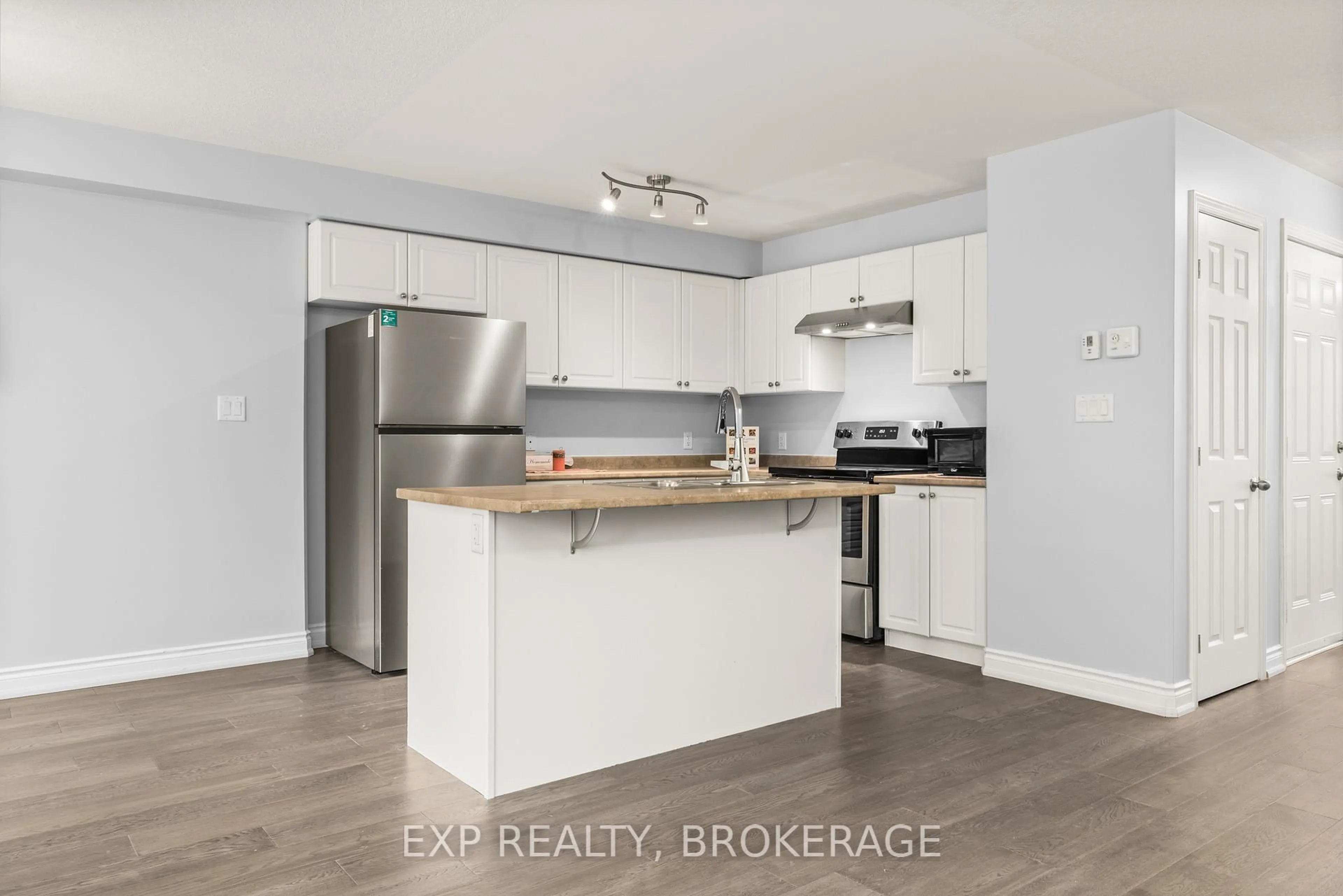 Open concept kitchen, wood/laminate floor for 82 Amy Lynn Dr, Loyalist Ontario K7N 1K2