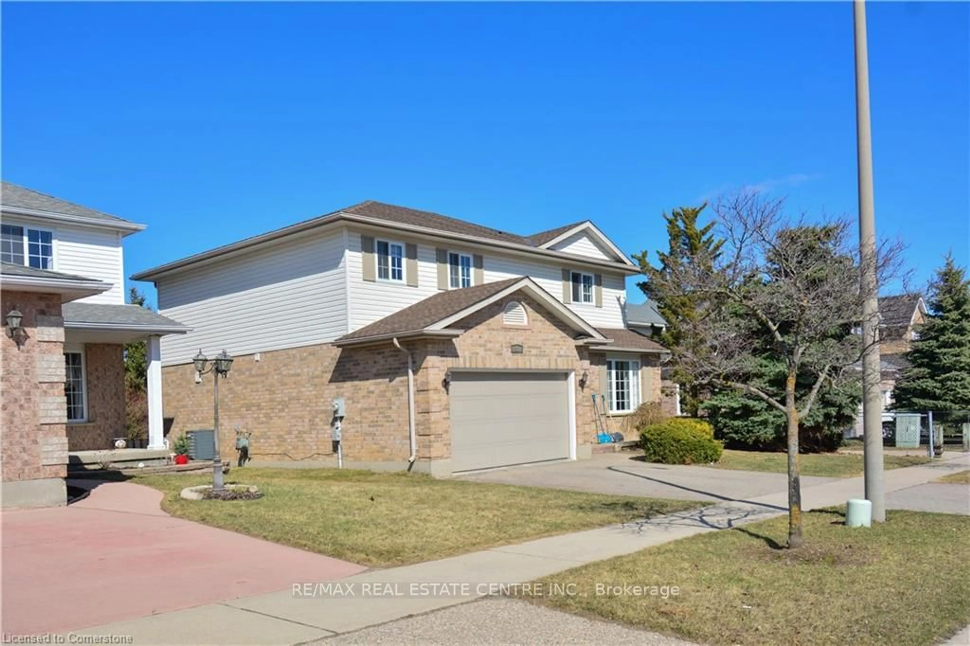 Home with brick exterior material, street for 187 DAIMLER Dr, Kitchener Ontario N2A 4C8