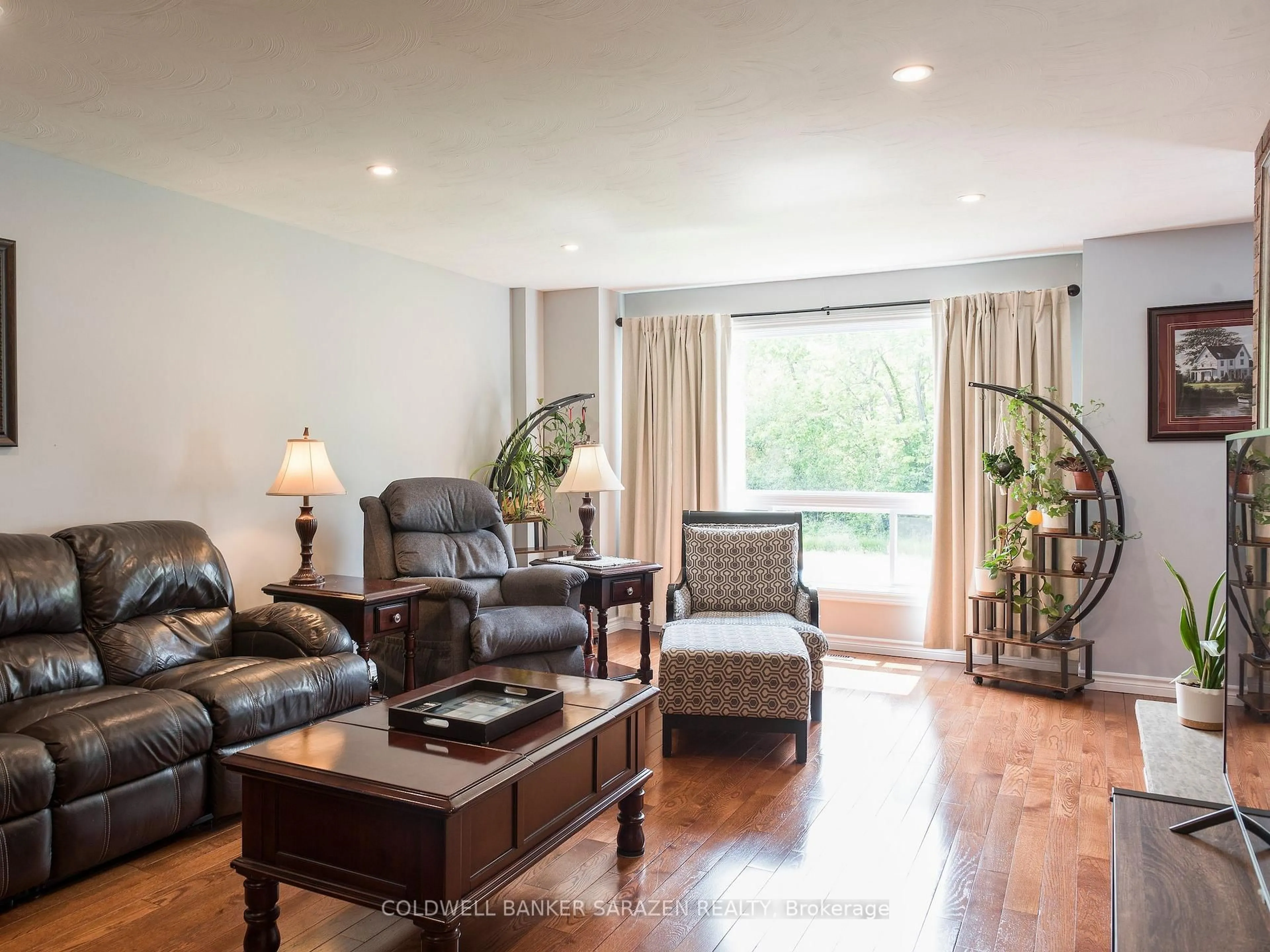 Living room with furniture, wood/laminate floor for 331 Caruso St, Arnprior Ontario K7S 3K3