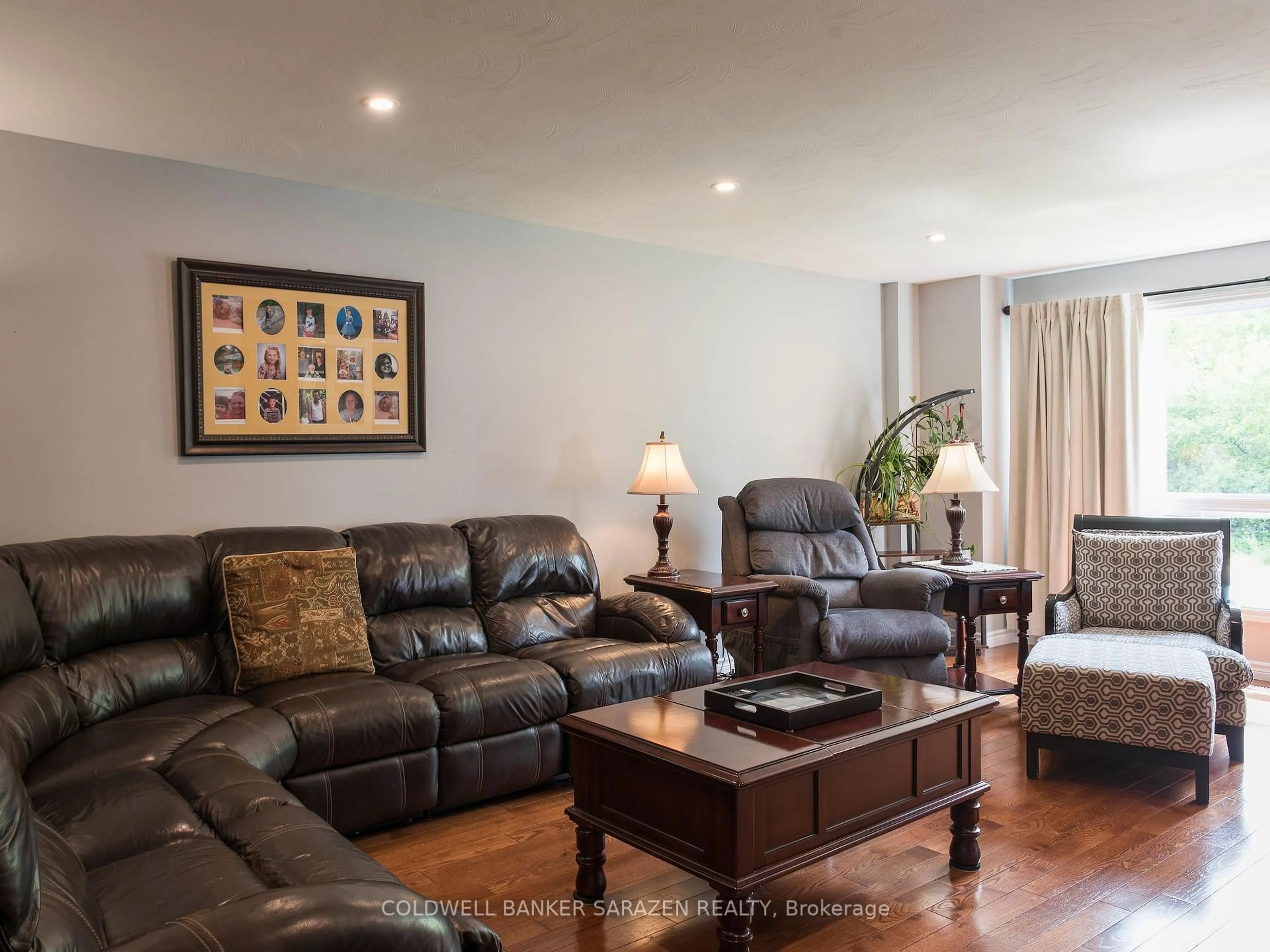 Living room with furniture, wood/laminate floor for 331 Caruso St, Arnprior Ontario K7S 3K3