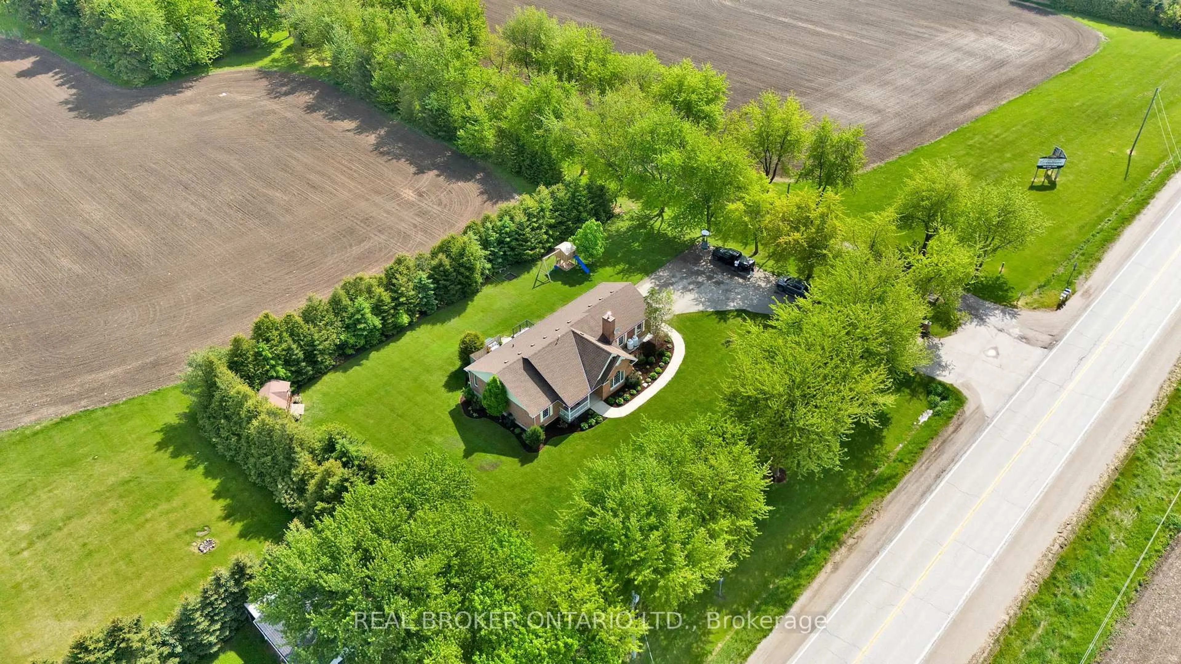 A pic from outside/outdoor area/front of a property/back of a property/a pic from drone, street for 7635 Wellington Road 7, Mapleton Ontario N0B 1A0