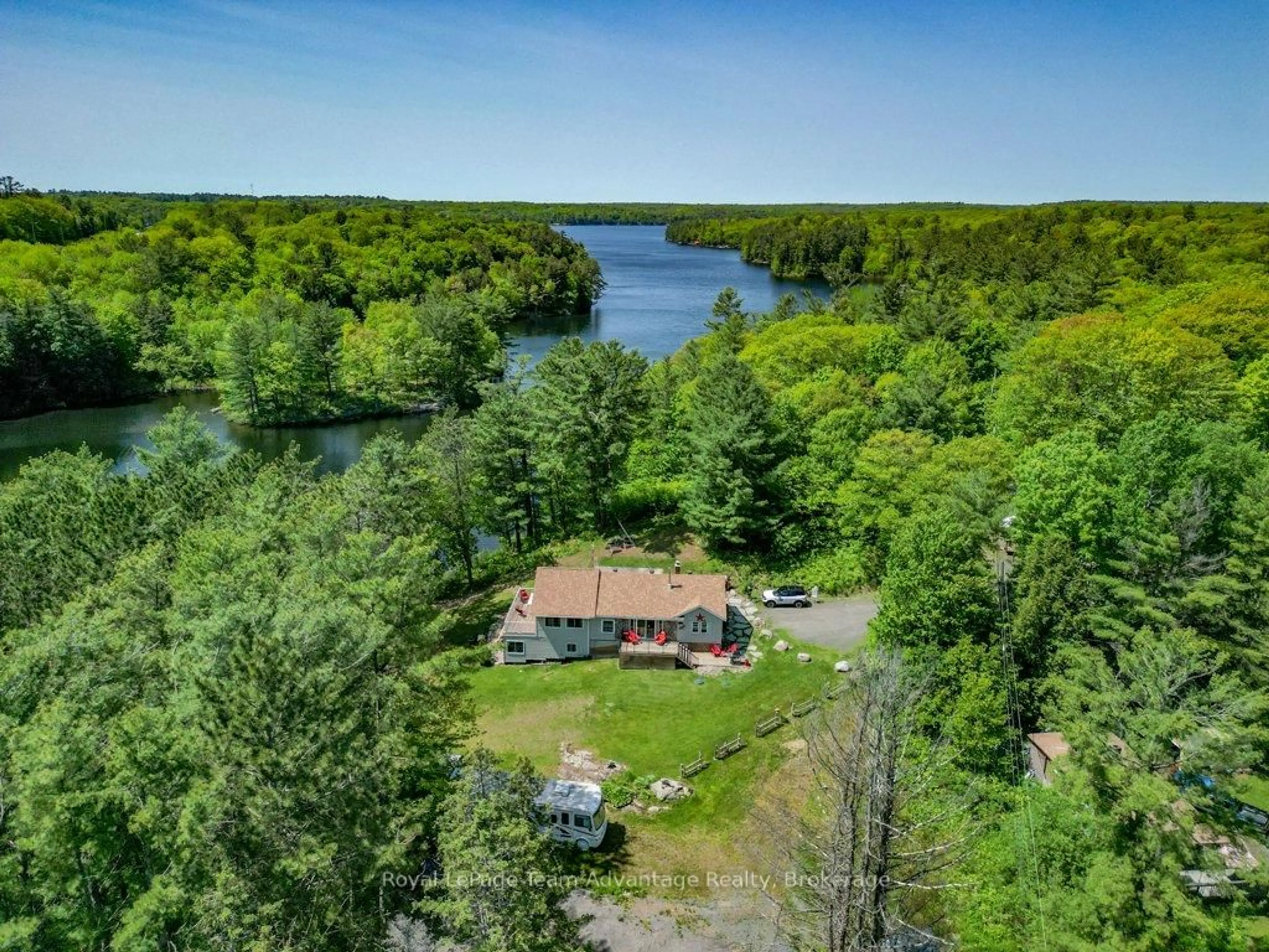 A pic from outside/outdoor area/front of a property/back of a property/a pic from drone, water/lake/river/ocean view for 19 Allan Cres, Seguin Ontario P2A 2W8
