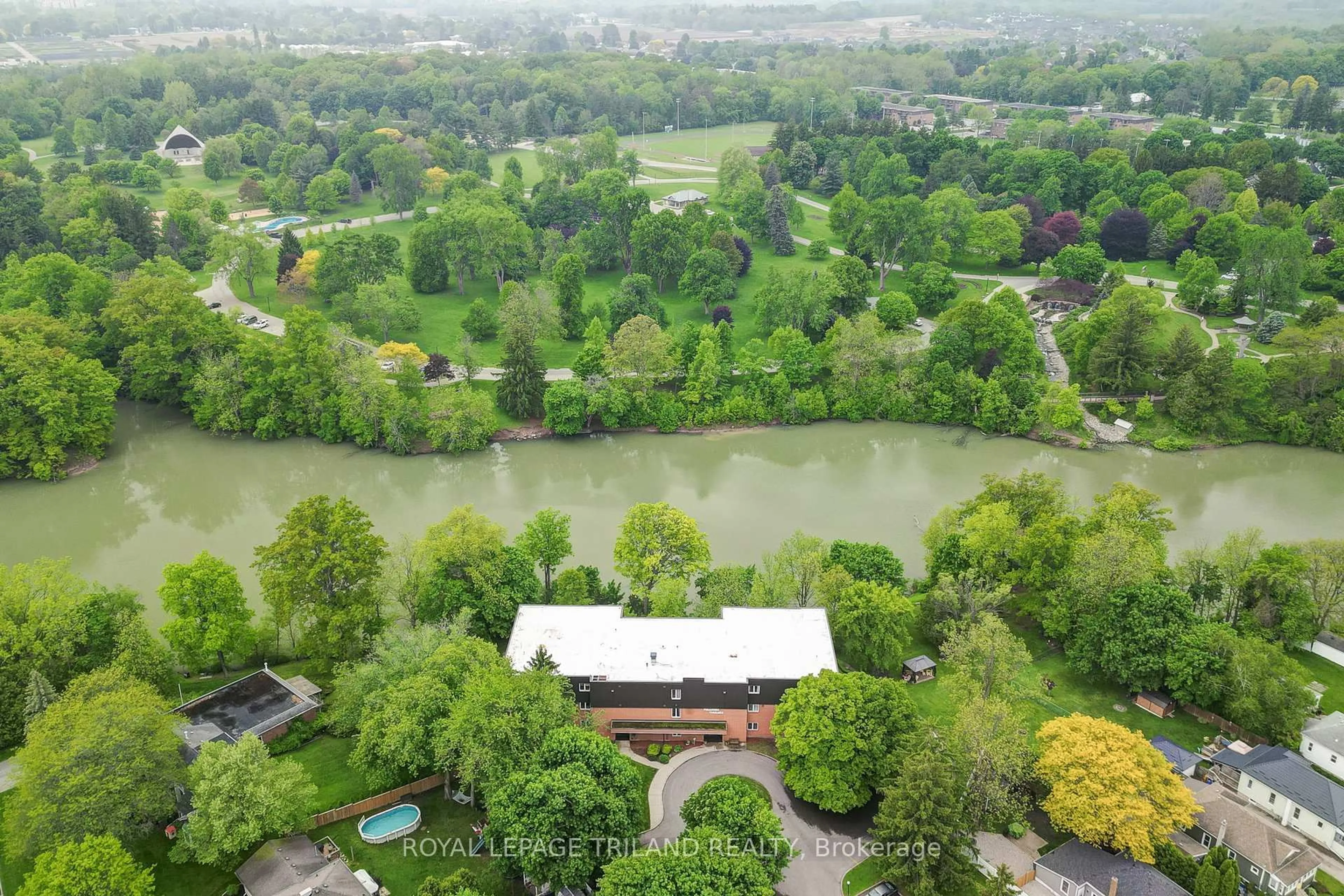 A pic from outside/outdoor area/front of a property/back of a property/a pic from drone, water/lake/river/ocean view for 125 Elm St #11, St. Thomas Ontario N5R 1H9