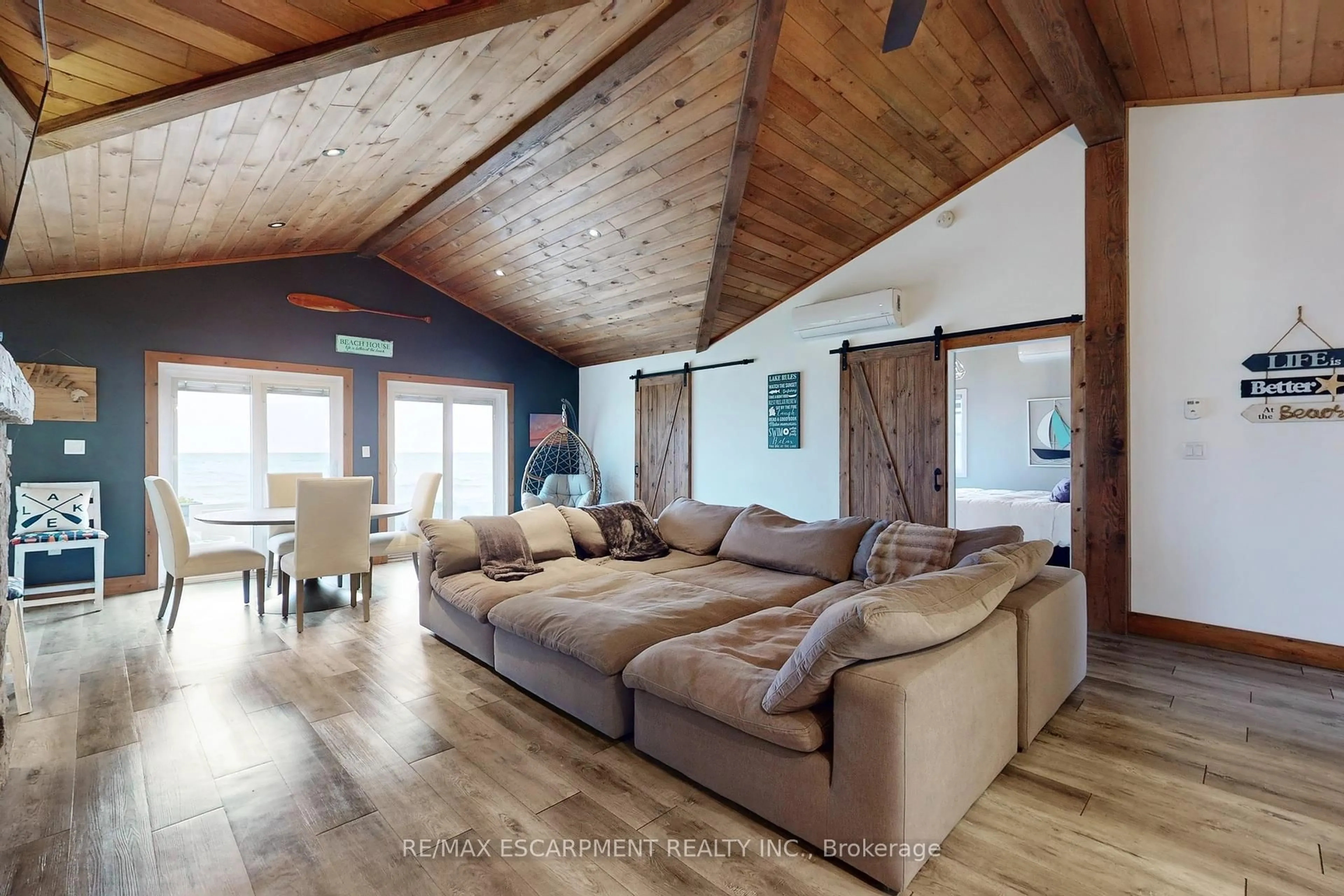 Living room with furniture, wood/laminate floor for 11495 Cook Lane, Wainfleet Ontario L0S 1V0