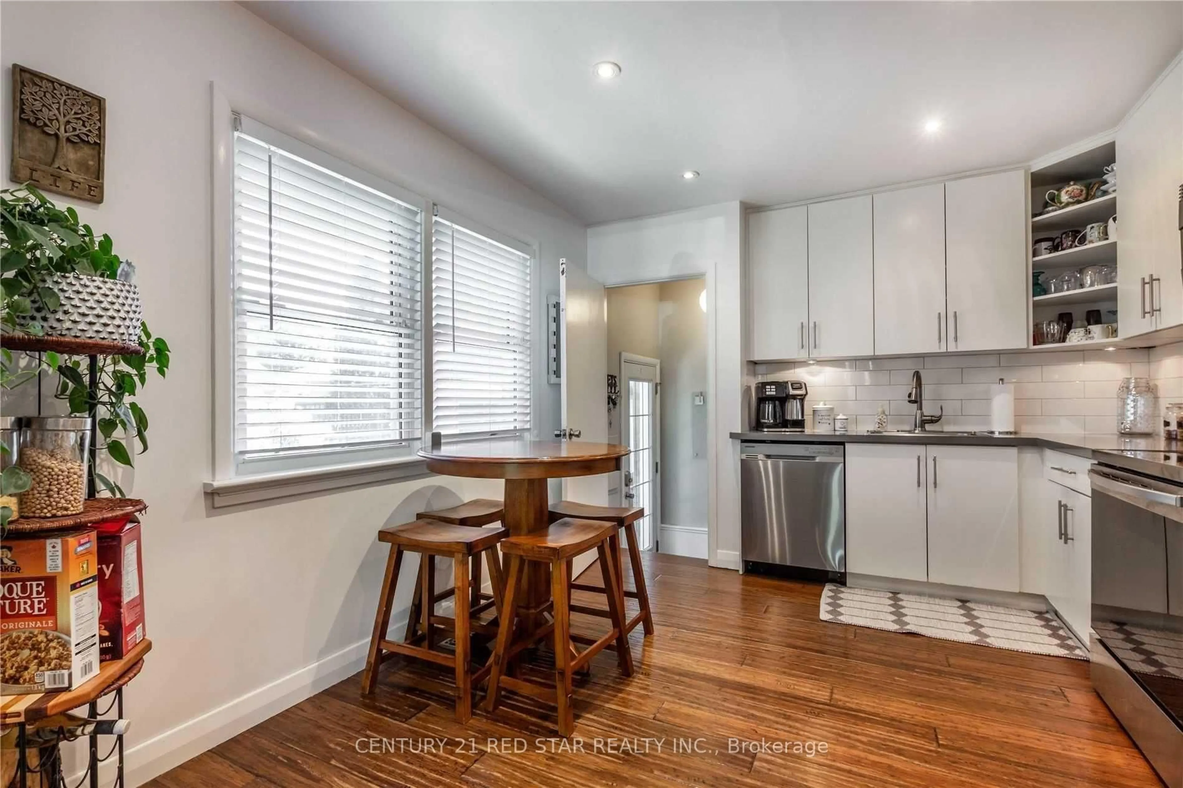 Open concept kitchen, wood/laminate floor for 107 Ellis Cres, Waterloo Ontario N2J 2C1