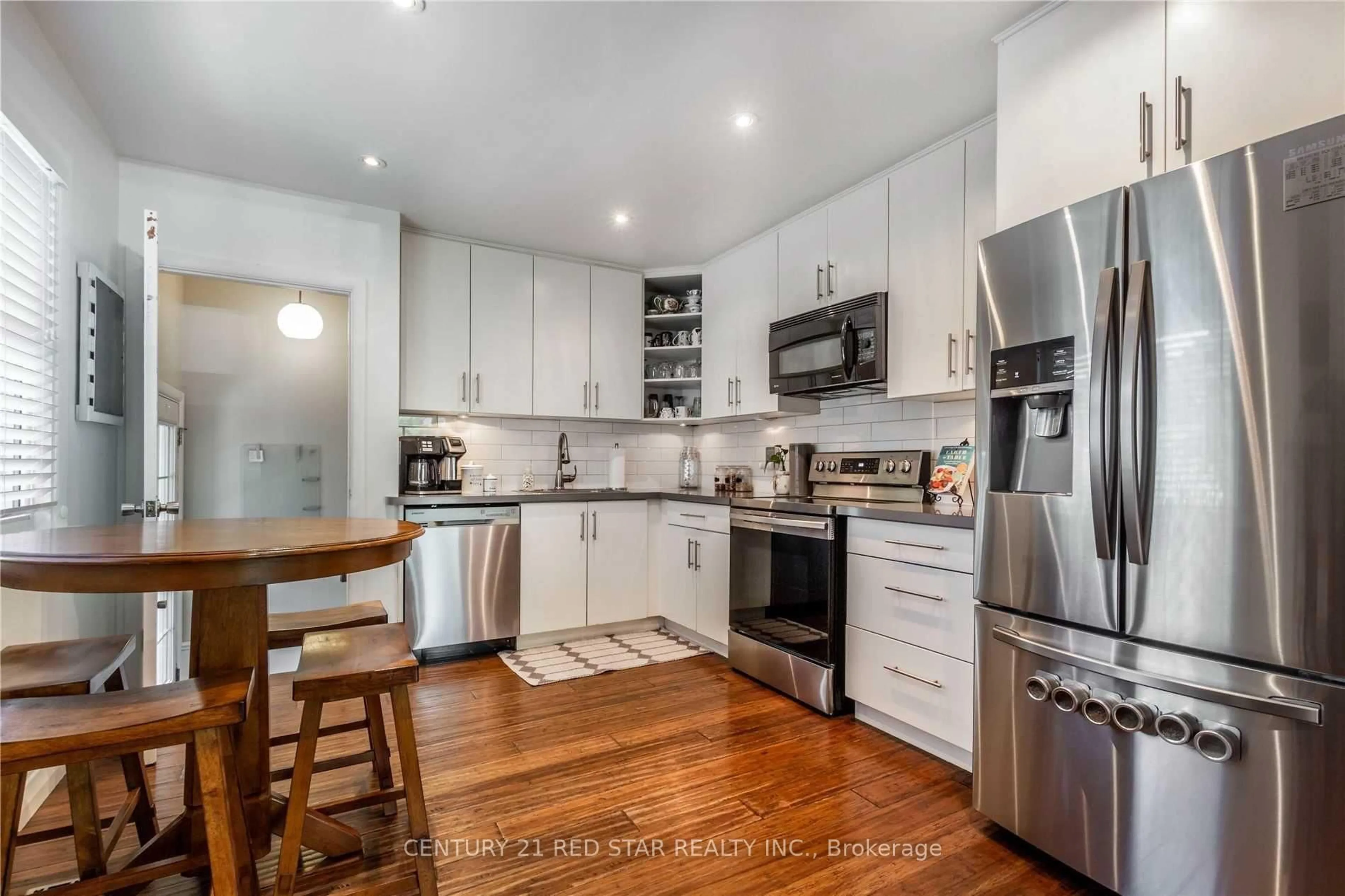 Open concept kitchen, wood/laminate floor for 107 Ellis Cres, Waterloo Ontario N2J 2C1