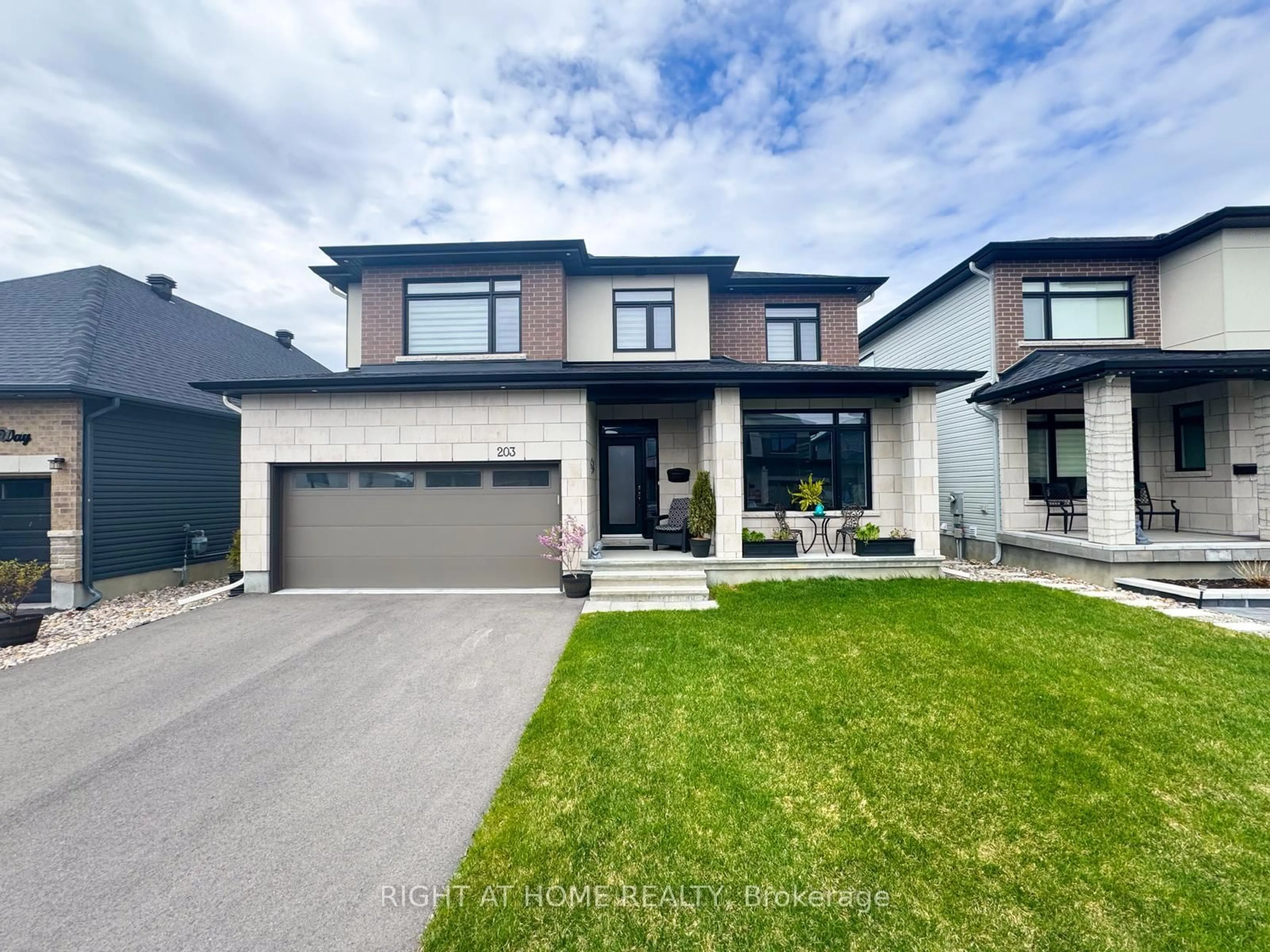 Home with brick exterior material, street for 203 Osterley Way, Ottawa Ontario K2S 2N6