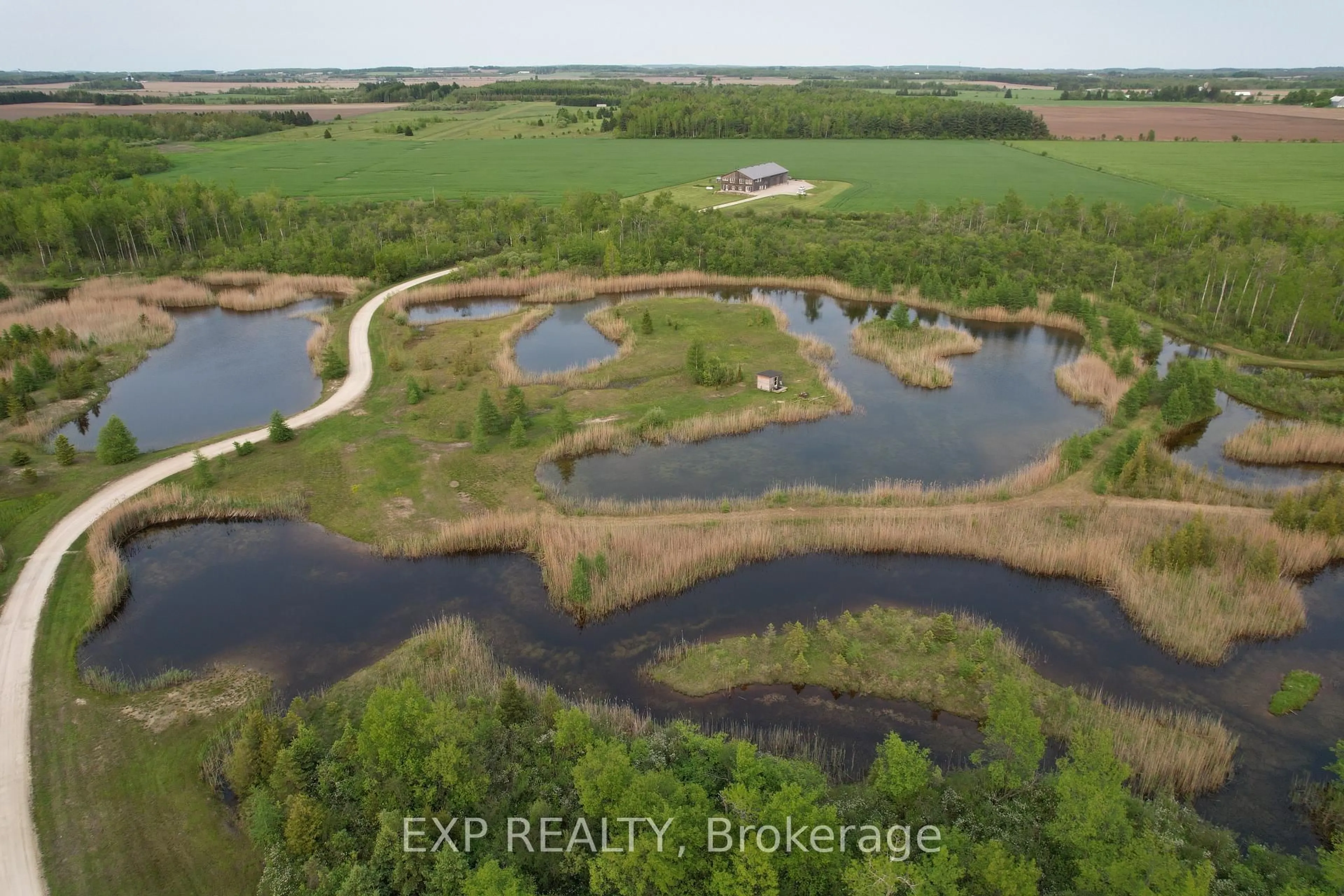 A pic from outside/outdoor area/front of a property/back of a property/a pic from drone, water/lake/river/ocean view for 295089 8th Line, Amaranth Ontario L9W 0K1