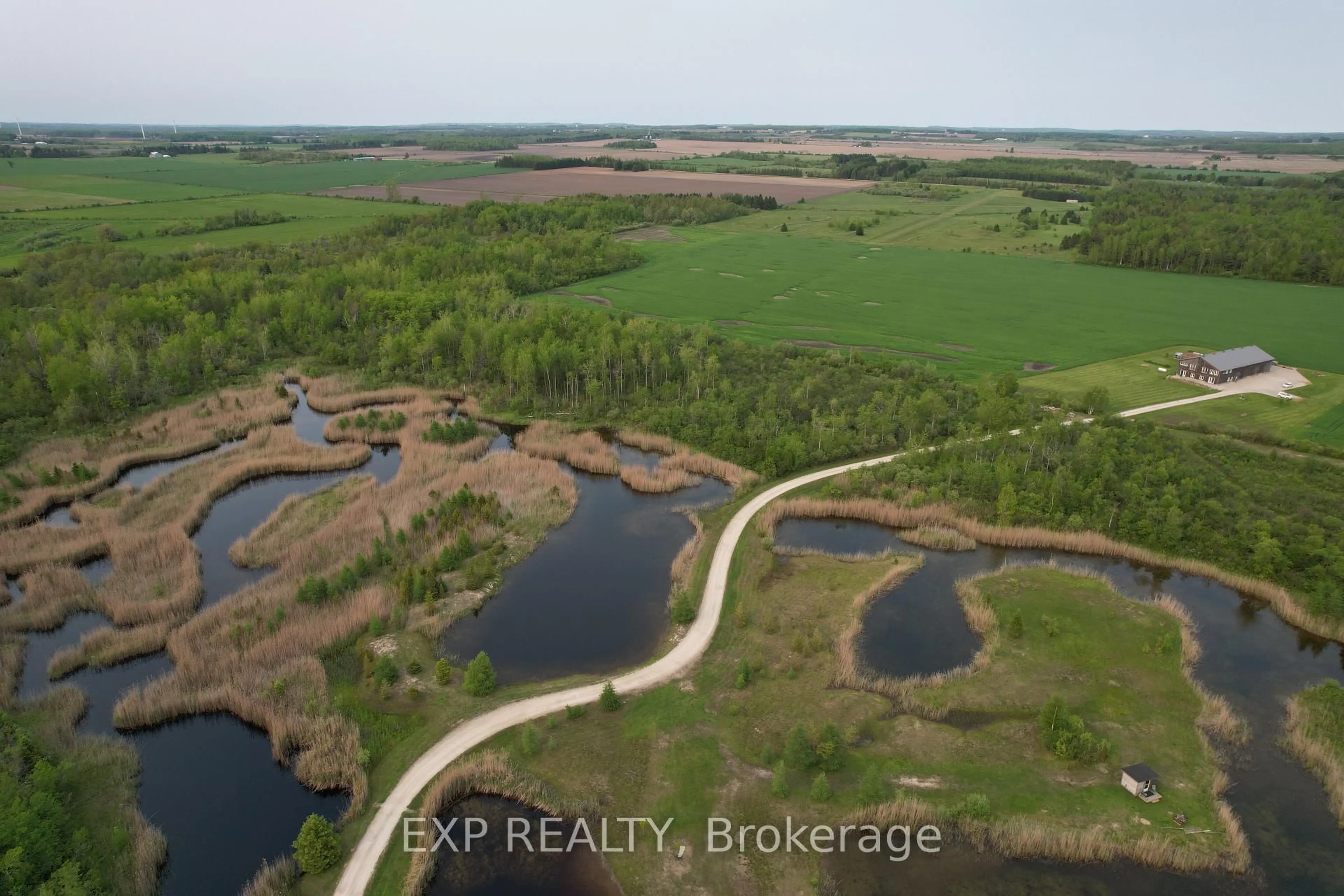 A pic from outside/outdoor area/front of a property/back of a property/a pic from drone, water/lake/river/ocean view for 295089 8th Line, Amaranth Ontario L9W 0K1