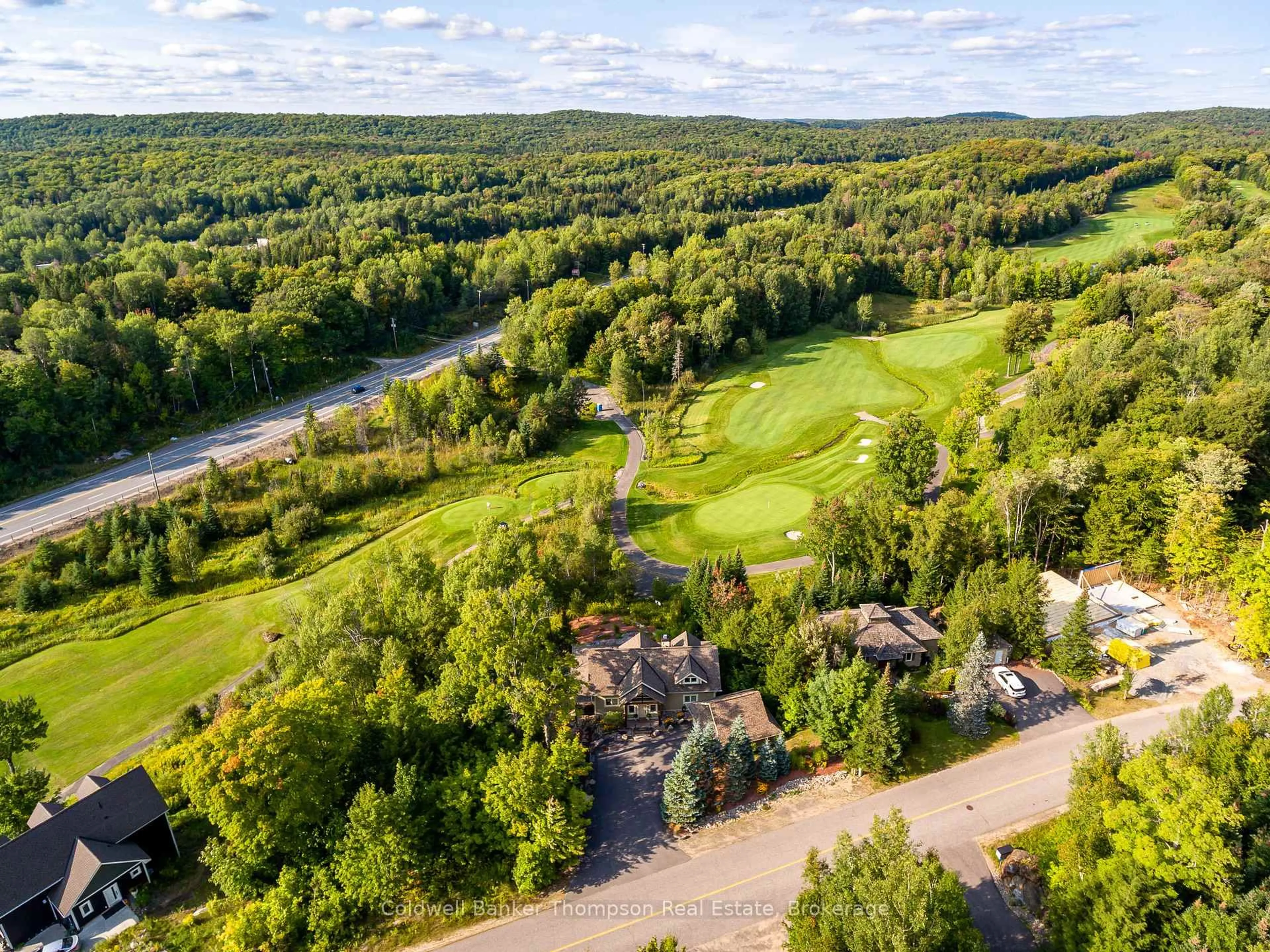 A pic from outside/outdoor area/front of a property/back of a property/a pic from drone, water/lake/river/ocean view for 21 Deerhurst Highlands Dr, Huntsville Ontario P1H 1B1