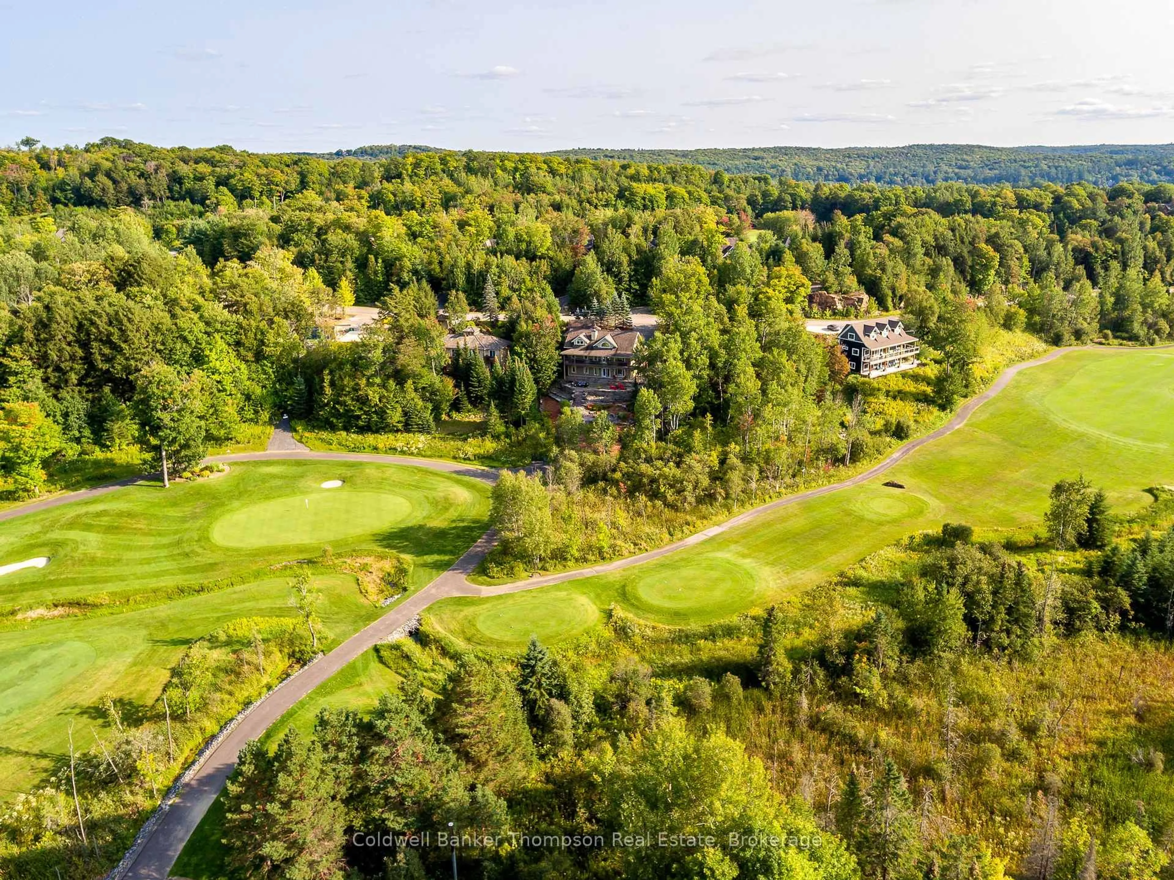 A pic from outside/outdoor area/front of a property/back of a property/a pic from drone, forest/trees view for 21 Deerhurst Highlands Dr, Huntsville Ontario P1H 1B1