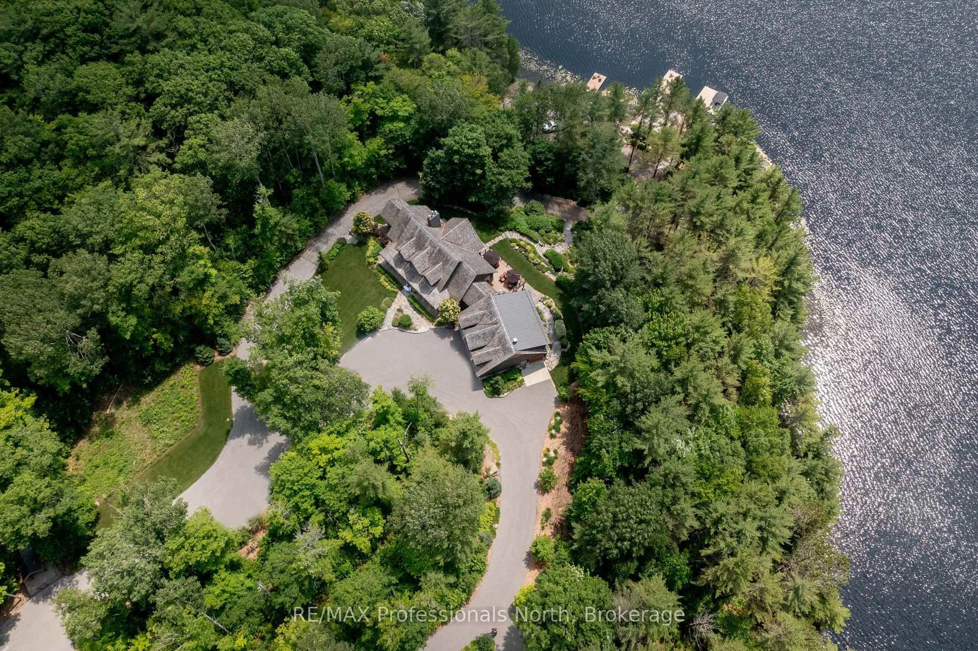 A pic from outside/outdoor area/front of a property/back of a property/a pic from drone, water/lake/river/ocean view for 1600 Misty Knoll Tr, Dysart et al Ontario K0M 1S0