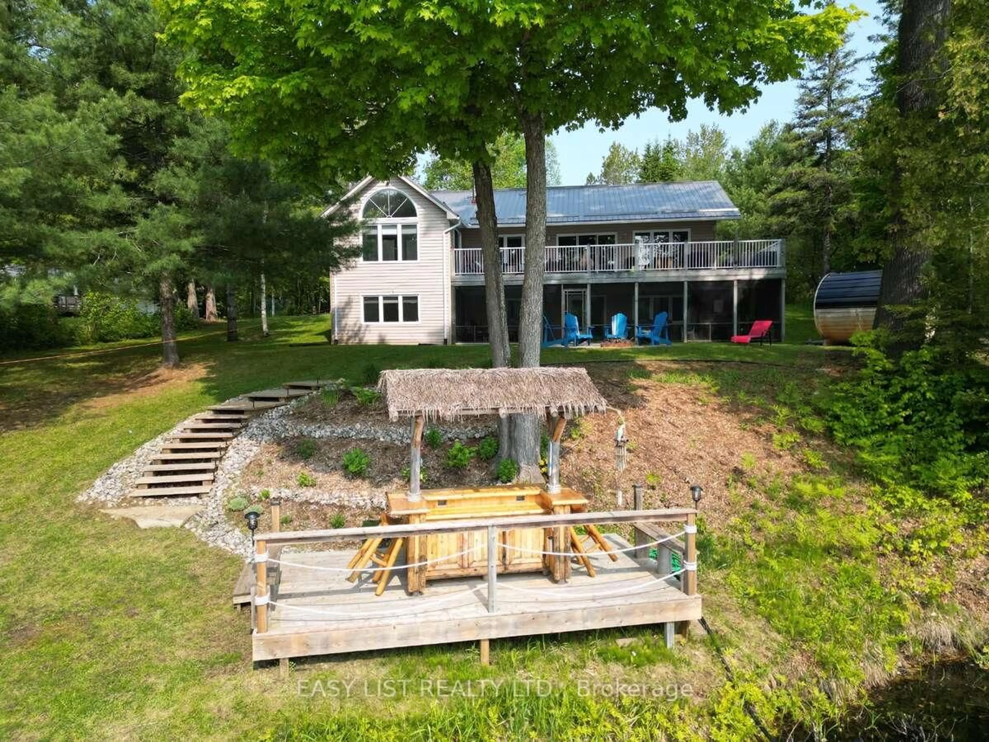 A pic from outside/outdoor area/front of a property/back of a property/a pic from drone, water/lake/river/ocean view for 15168 Hwy 118 N/A, Dysart et al Ontario K0M 1S0