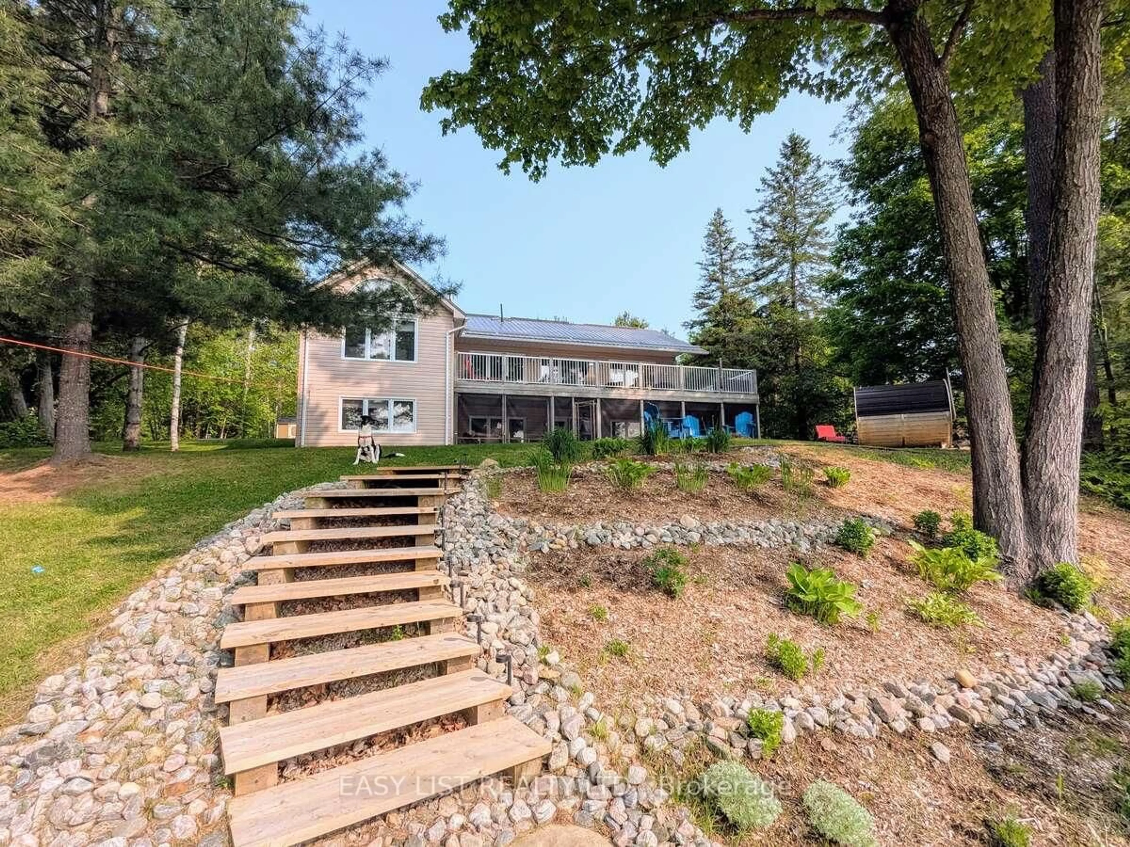 A pic from outside/outdoor area/front of a property/back of a property/a pic from drone, mountain view for 15168 Hwy 118, Dysart et al Ontario K0M 1S0
