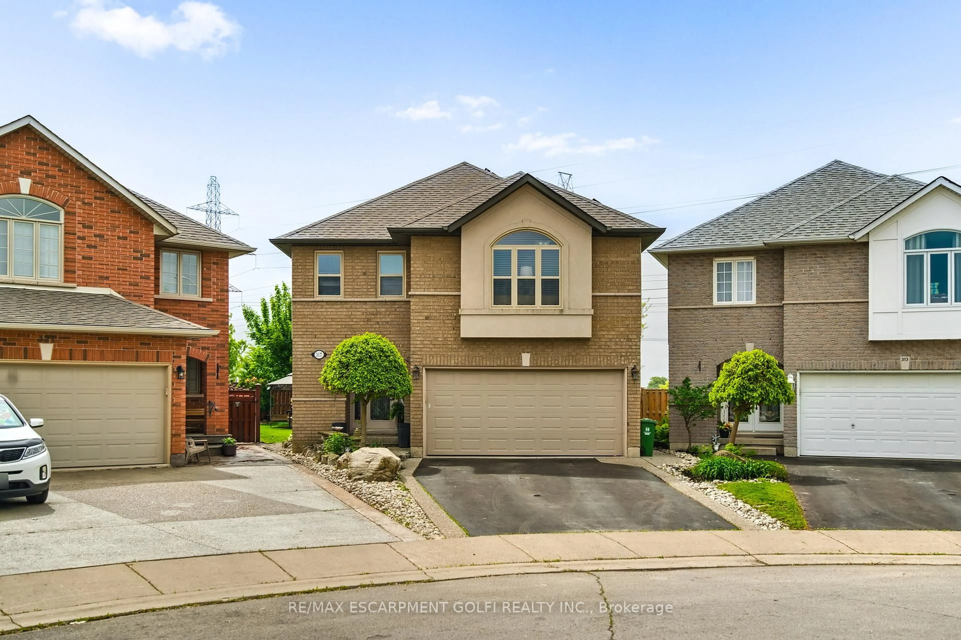 Home with brick exterior material, street for 317 Jacqueline Blvd, Hamilton Ontario L9B 2V7