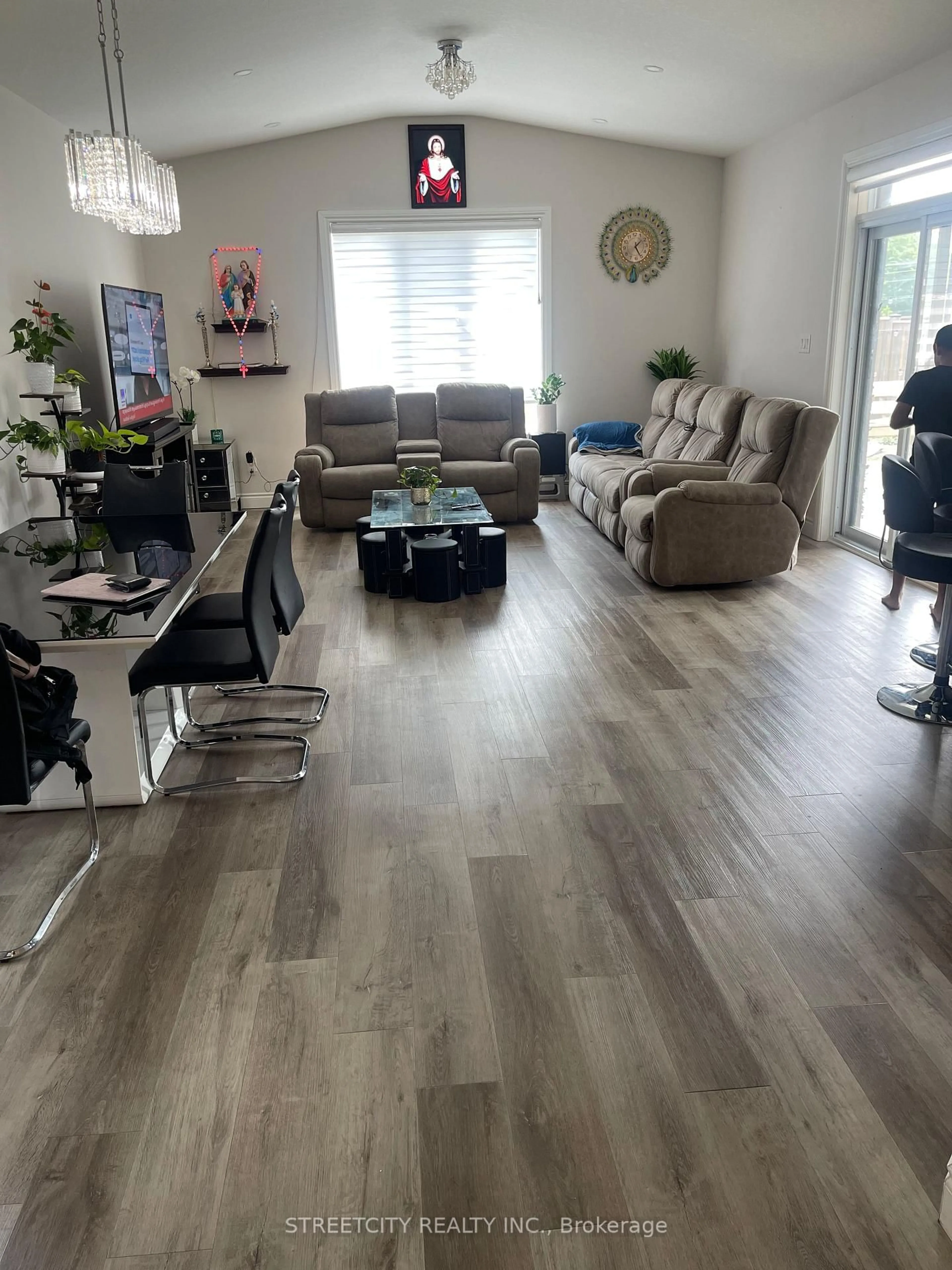 Living room with furniture, wood/laminate floor for 1754 Henrica Ave, London North Ontario N6G 0Y2