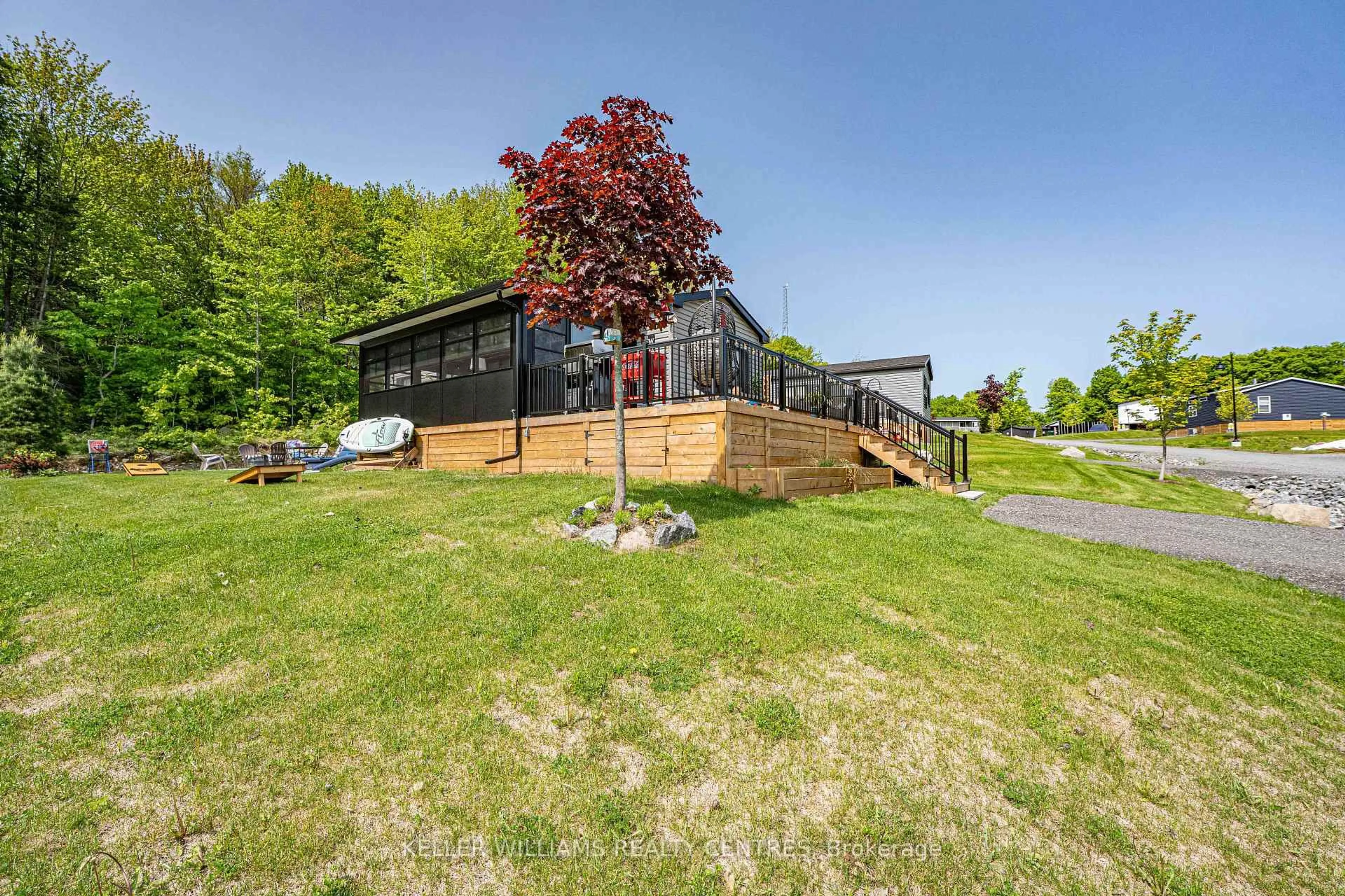A pic from outside/outdoor area/front of a property/back of a property/a pic from drone, water/lake/river/ocean view for 1047 Bonnie Lake Camp Rd ##38 Lakeridge, Bracebridge Ontario P1L 1W9