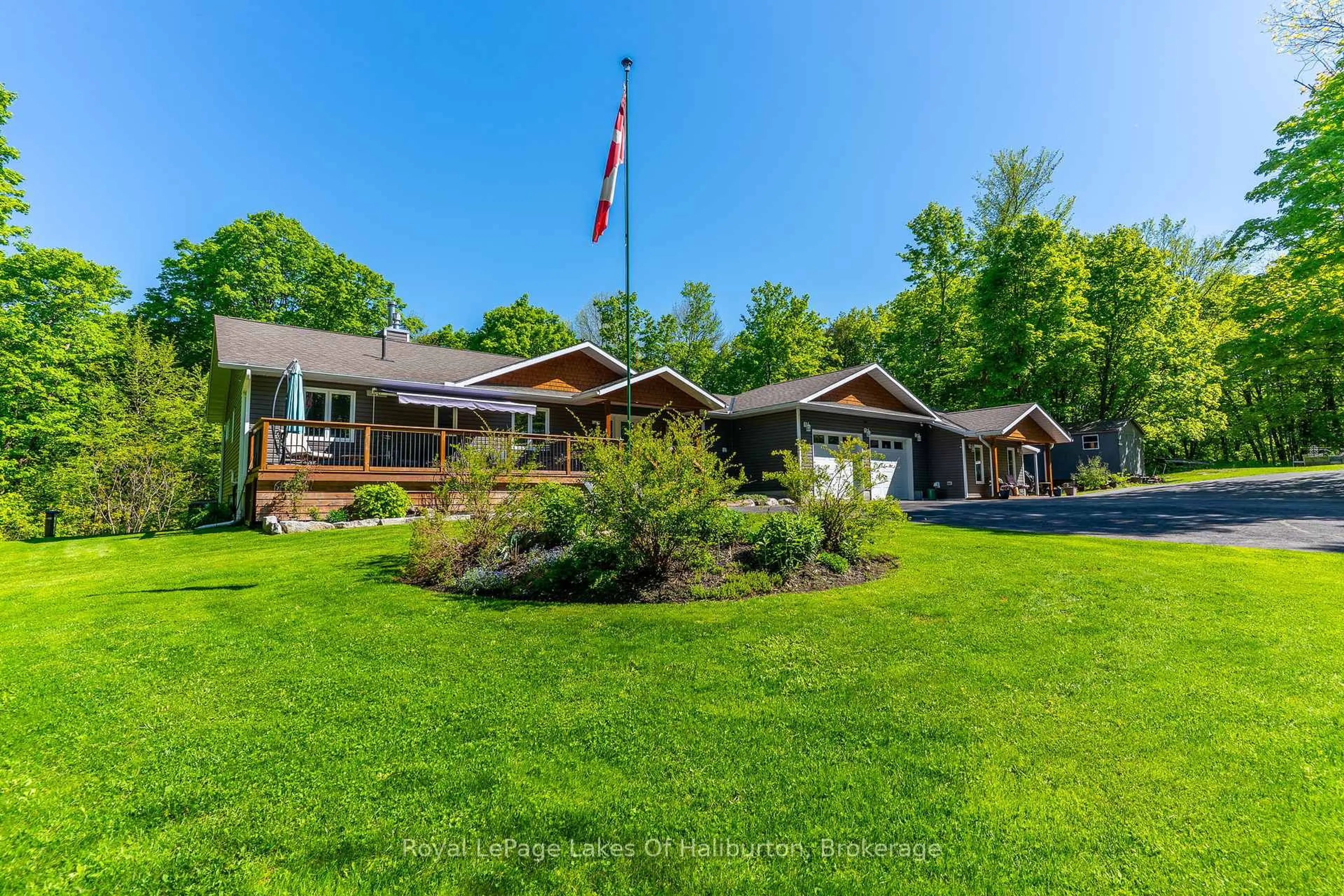 A pic from outside/outdoor area/front of a property/back of a property/a pic from drone, water/lake/river/ocean view for 1117 Burkes Rd, Dysart et al Ontario K0M 1S0