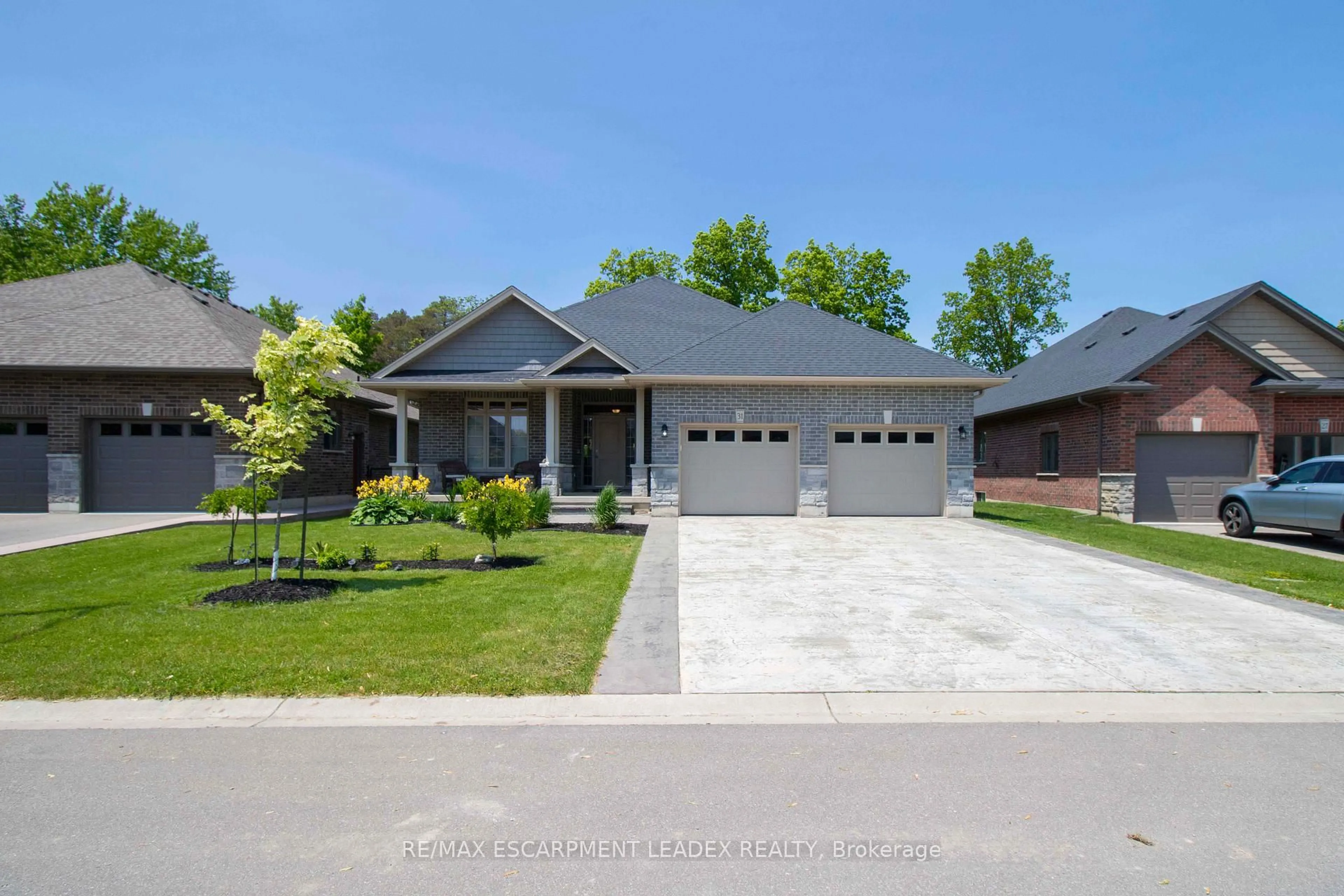 Home with brick exterior material, street for 31 Sycamore Dr, Norfolk Ontario N0A 1N6