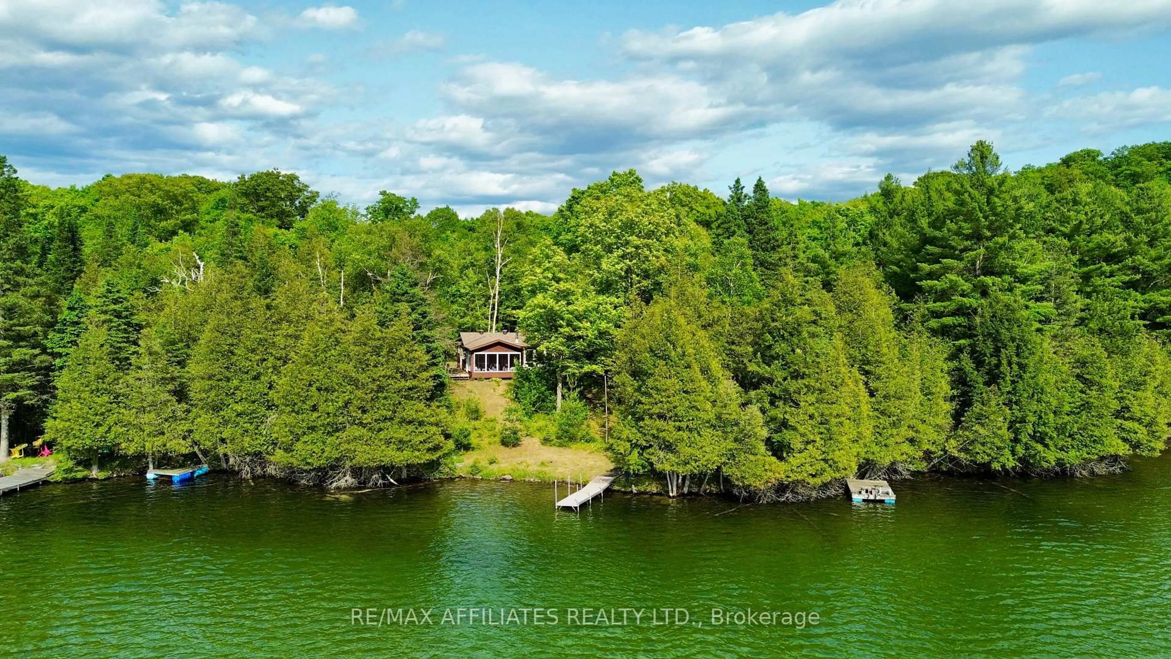 A pic from outside/outdoor area/front of a property/back of a property/a pic from drone, water/lake/river/ocean view for 1015 Penyck  Lake Lane North N/A, Sharbot Lake Ontario K0H 2P0