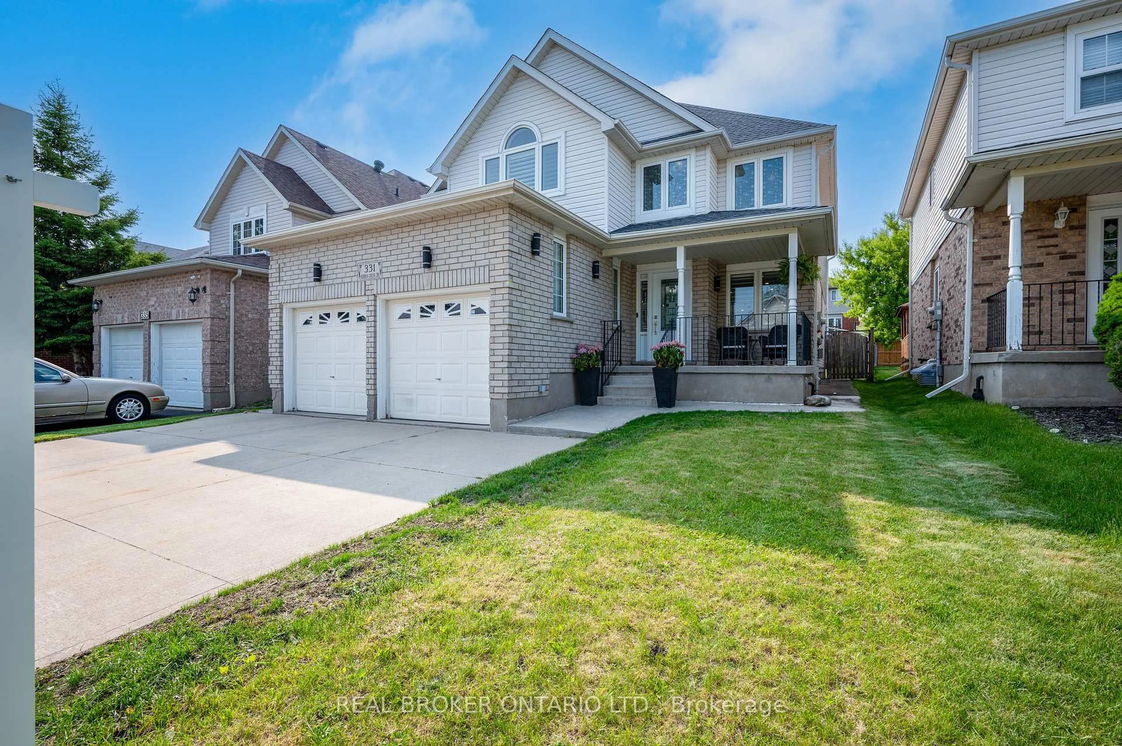 Home with brick exterior material, street for 331 Hidden Creek Dr, Kitchener Ontario N2N 3N3