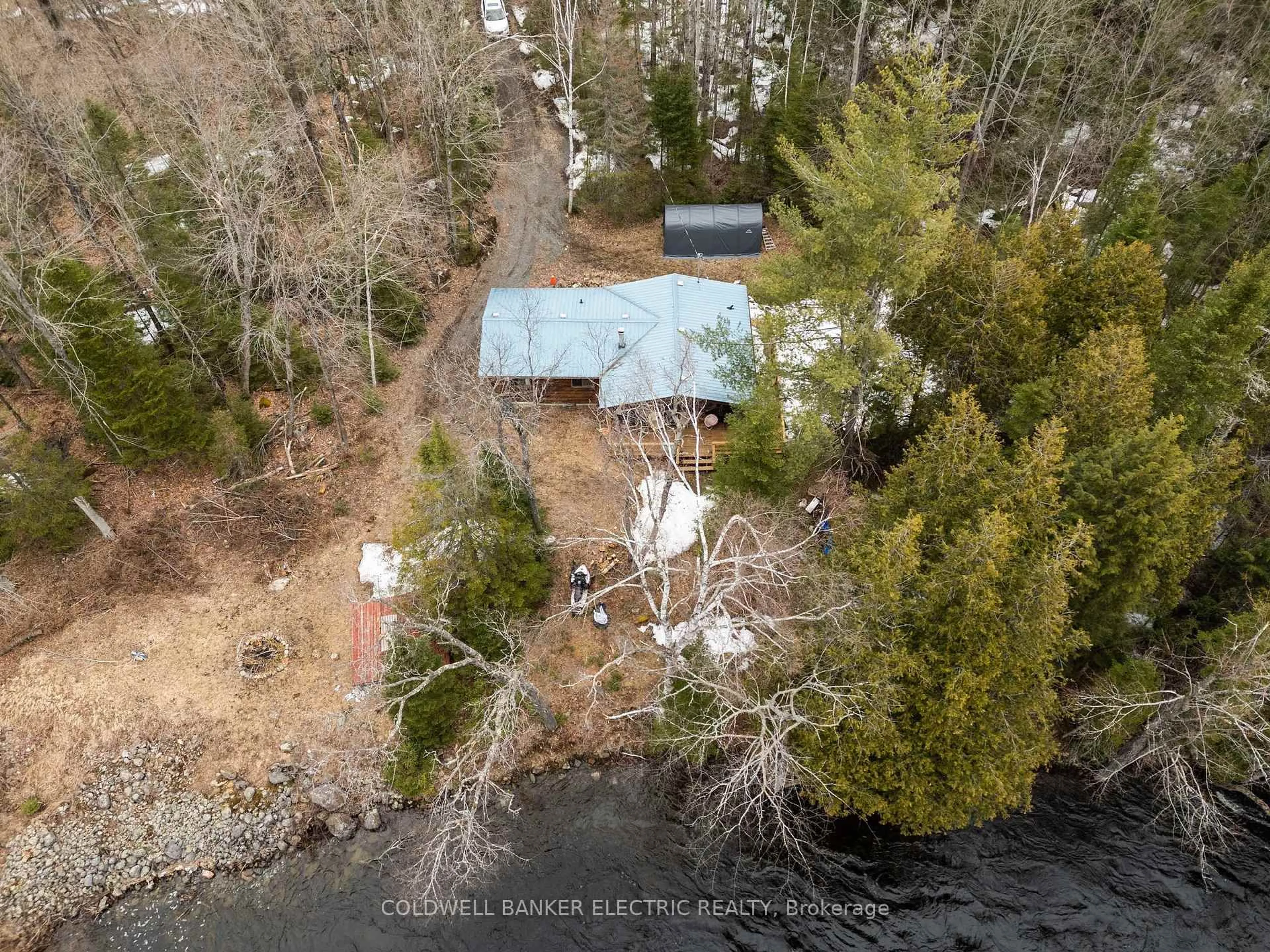 A pic from outside/outdoor area/front of a property/back of a property/a pic from drone, water/lake/river/ocean view for 2313 The South Rd, Coe Hill Ontario K0L 1P0