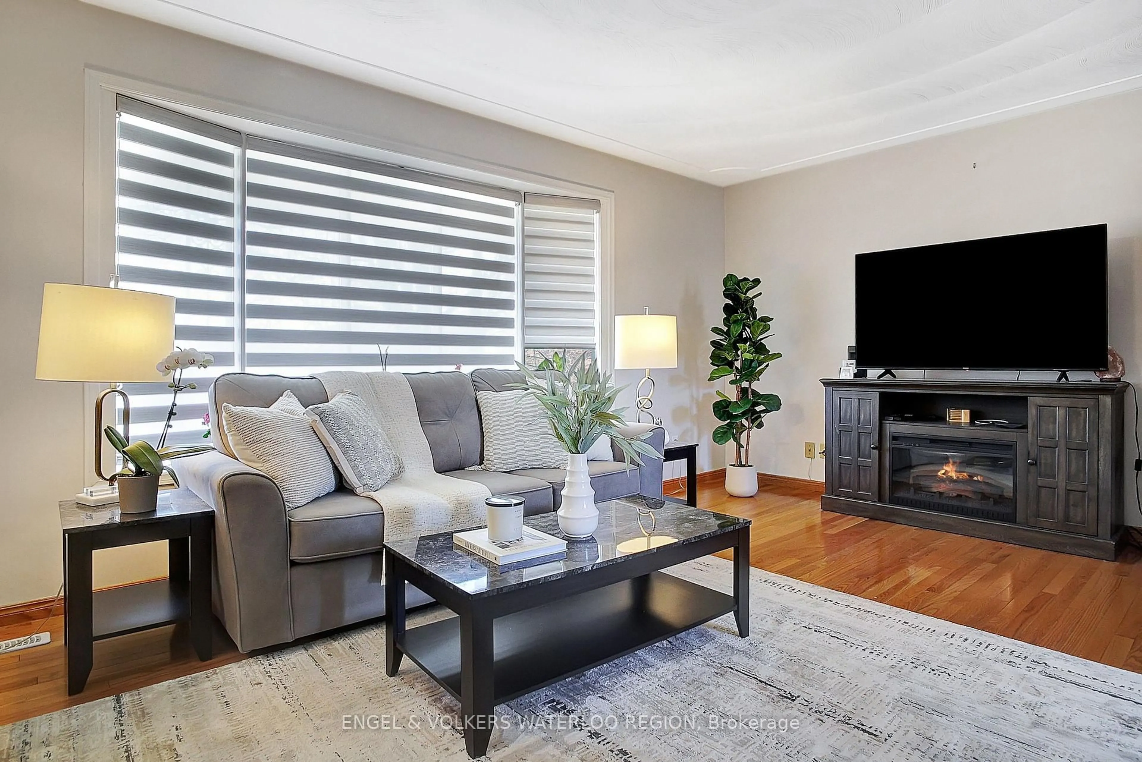 Living room with furniture, wood/laminate floor for 137 Wimbleton Cres, Kitchener Ontario N2B 3K4