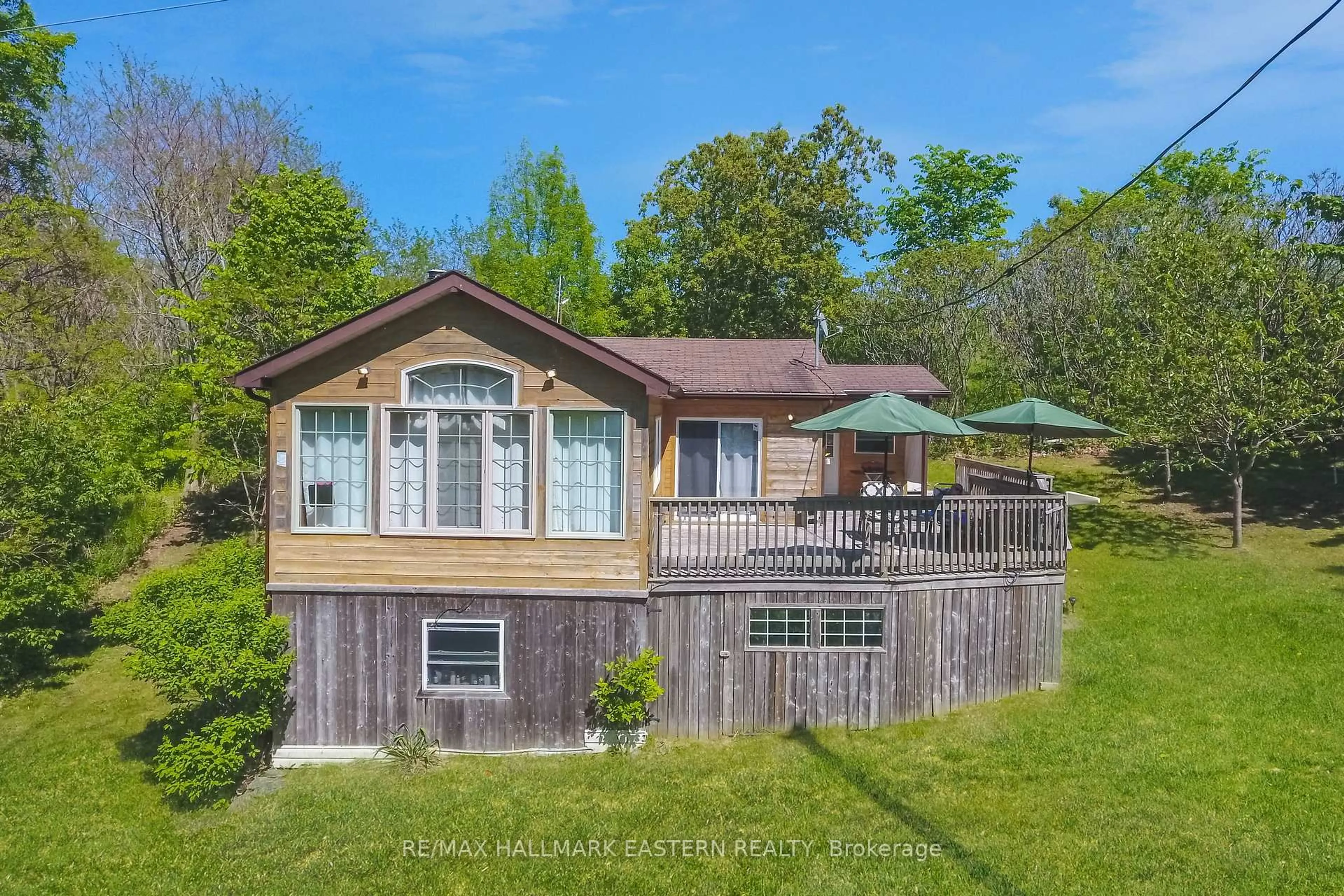 A pic from outside/outdoor area/front of a property/back of a property/a pic from drone, water/lake/river/ocean view for 50 Long Island, Otonabee-South Monaghan Ontario K0L 1B0