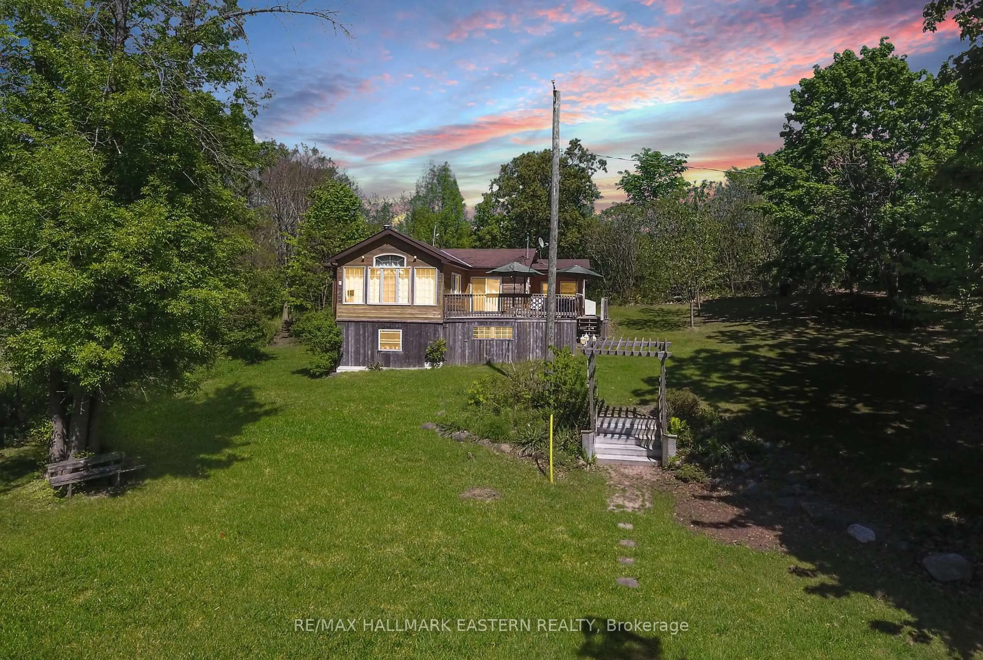 A pic from outside/outdoor area/front of a property/back of a property/a pic from drone, unknown for 50 Long Island, Otonabee-South Monaghan Ontario K0L 1B0