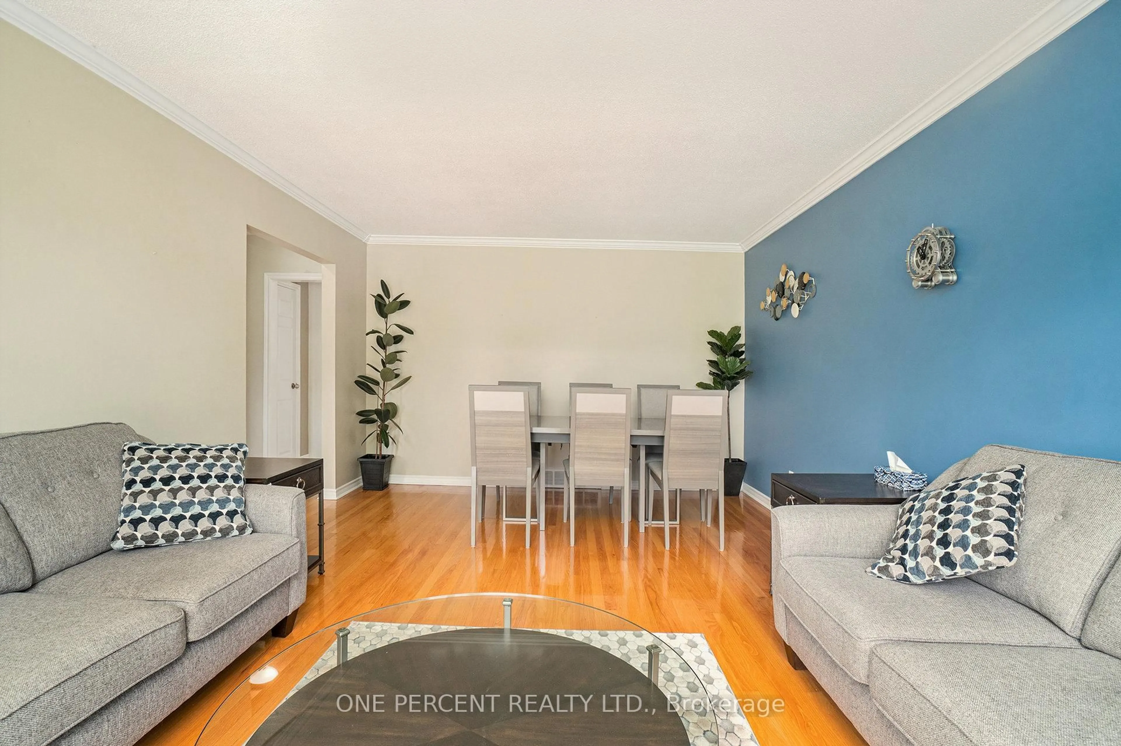 Living room with furniture, wood/laminate floor for 1208 Stanton Rd, Ottawa Ontario K2C 3E2