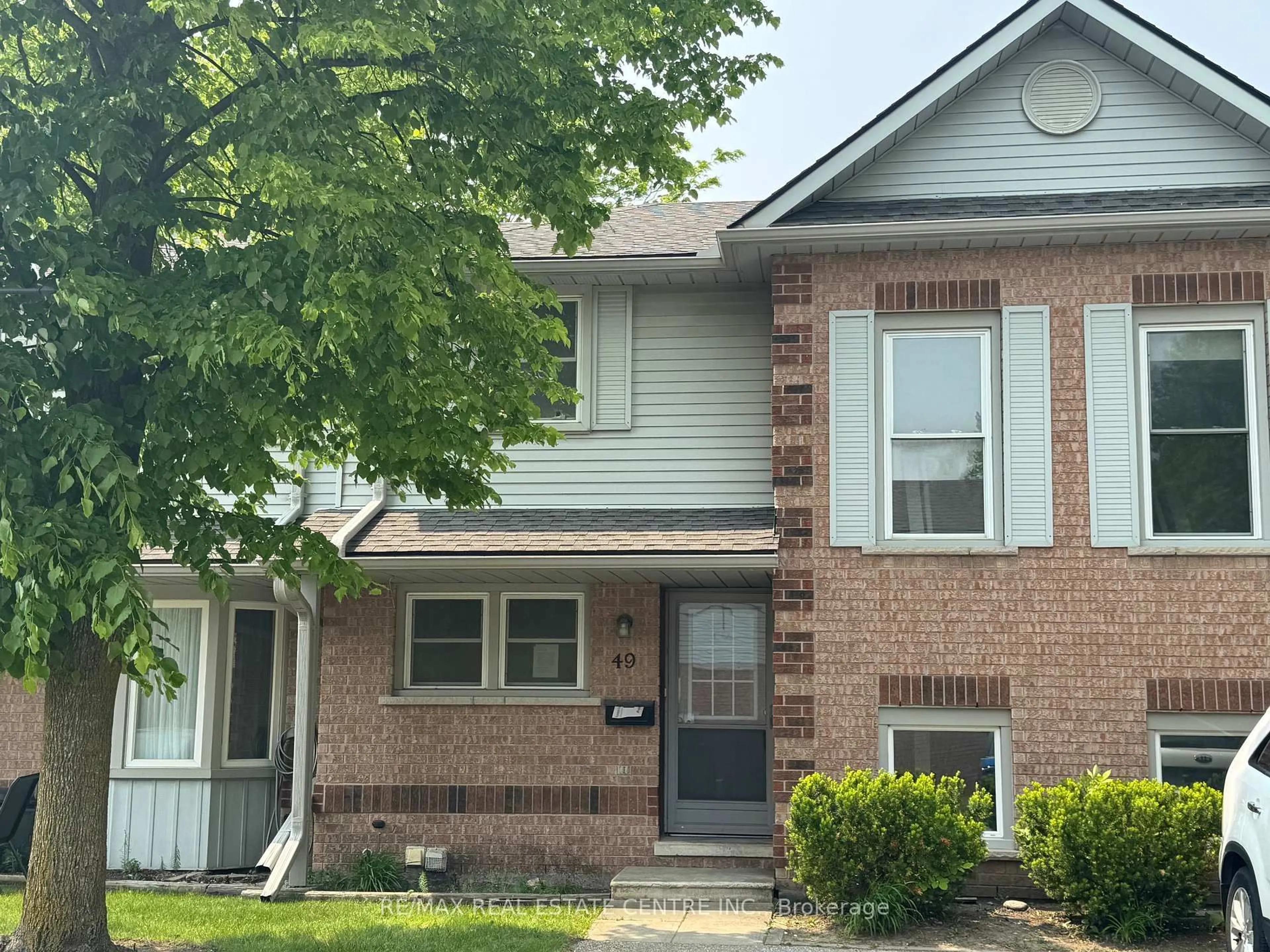 Home with brick exterior material, street for 180 Marksam Rd #49, Guelph Ontario N1H 8G4