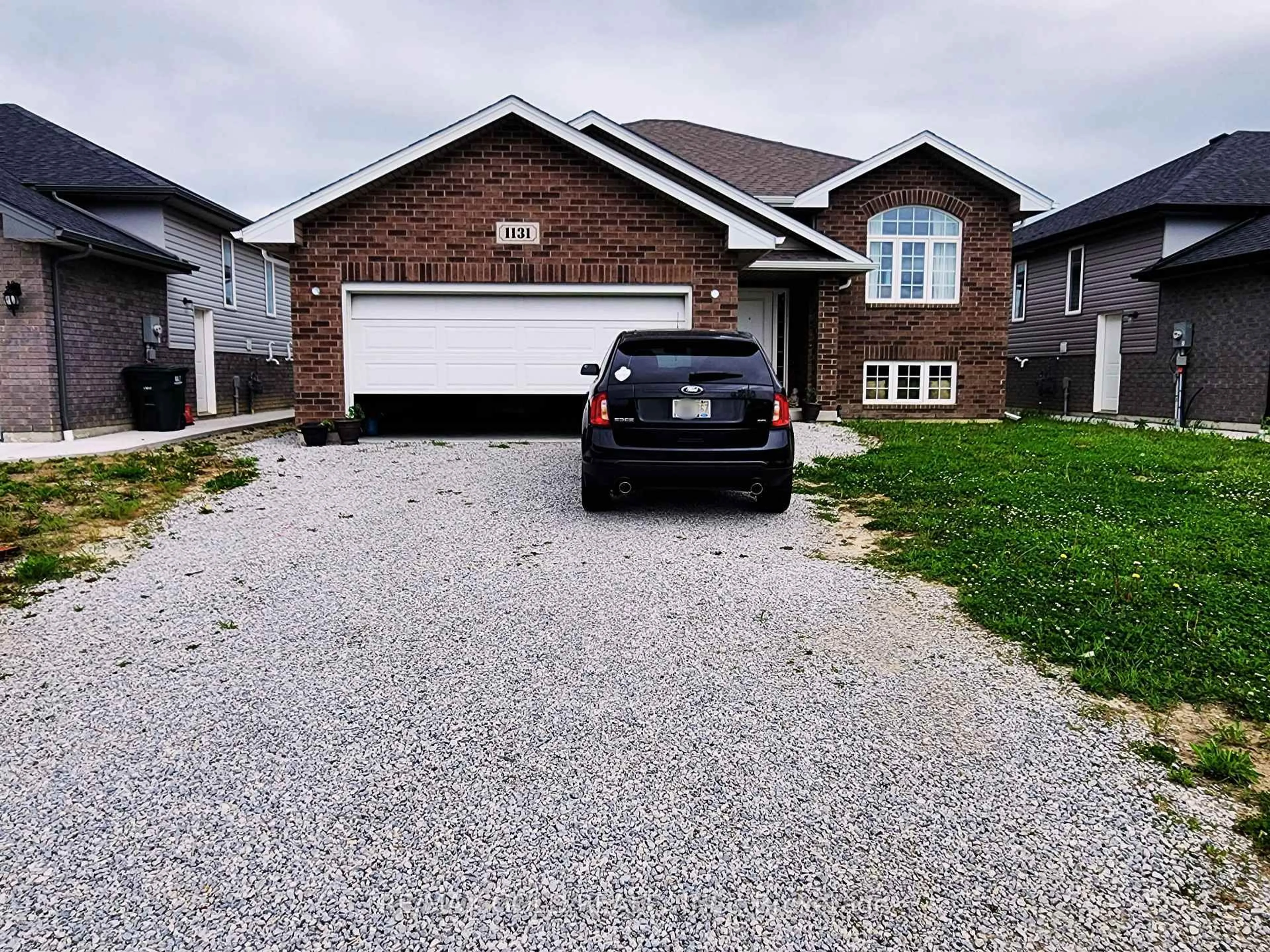 Home with brick exterior material, street for 1131 Aspen Ridge Cres, Lakeshore Ontario N0R 1A0